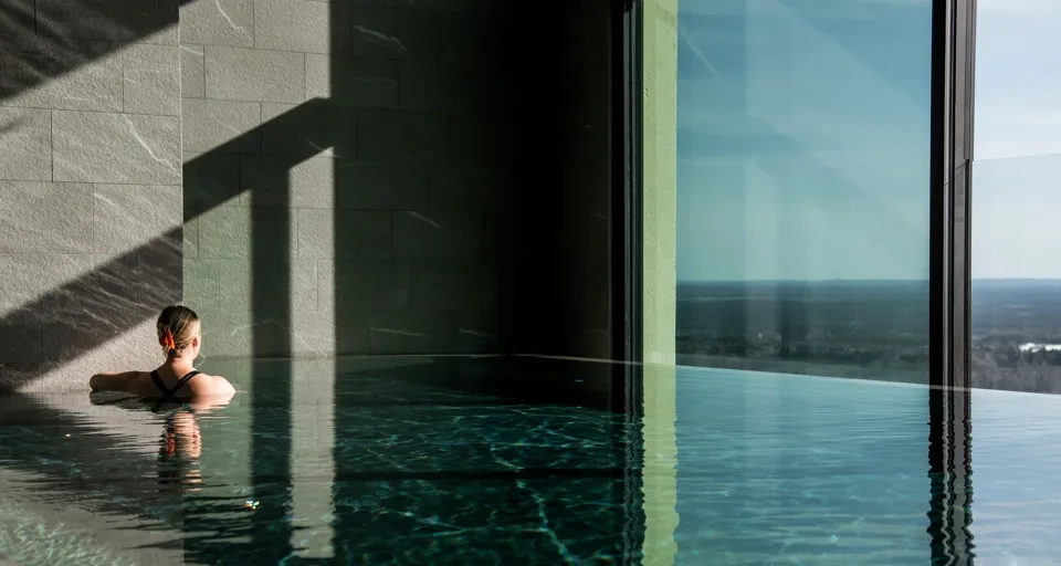 A person sitting in a pool of water.