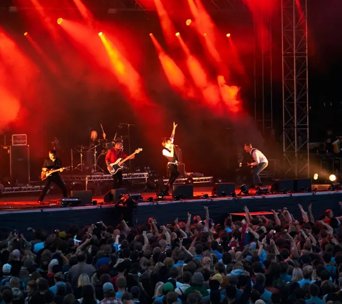 A group of people standing on top of a stage.