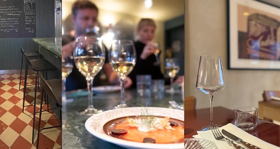 En man står framför en disk fylld med vinglas.