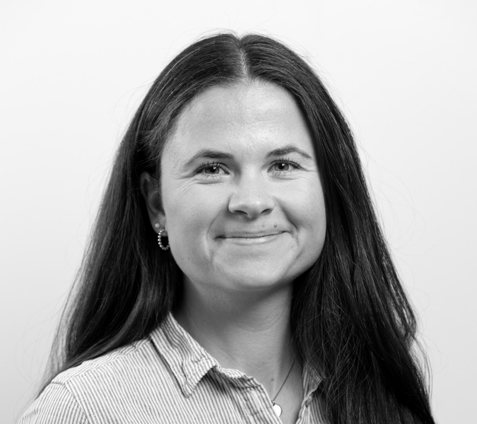A black and white photo of a woman with long hair.