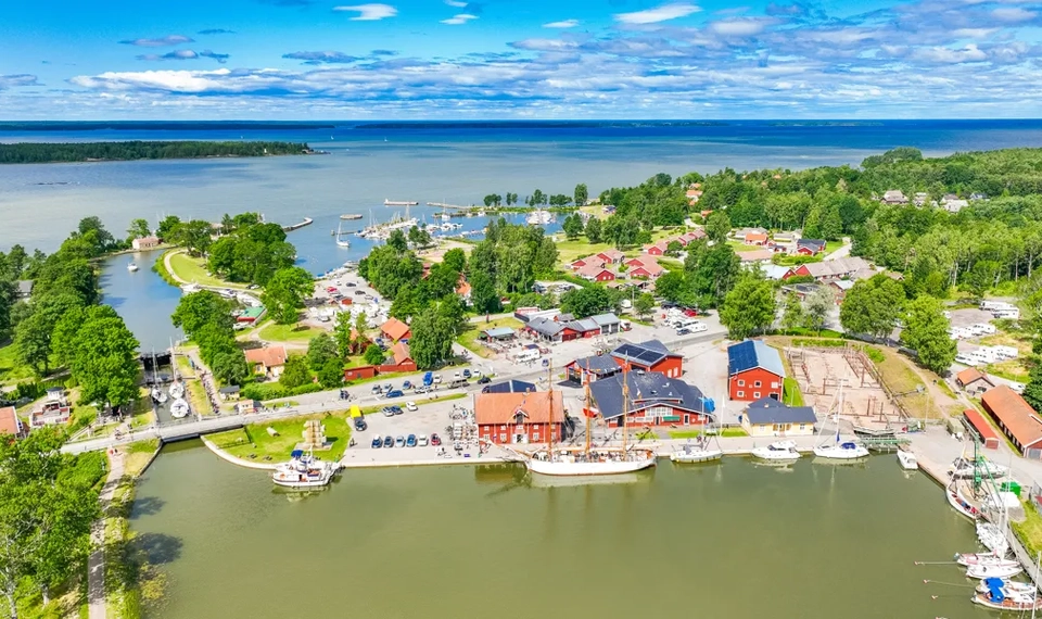 An aerial view of a small town by the water.