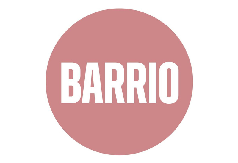 A pink circle with the word barrio on it.