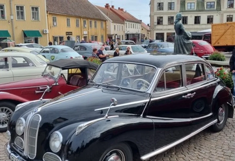 A group of cars parked next to each other in a parking lot.