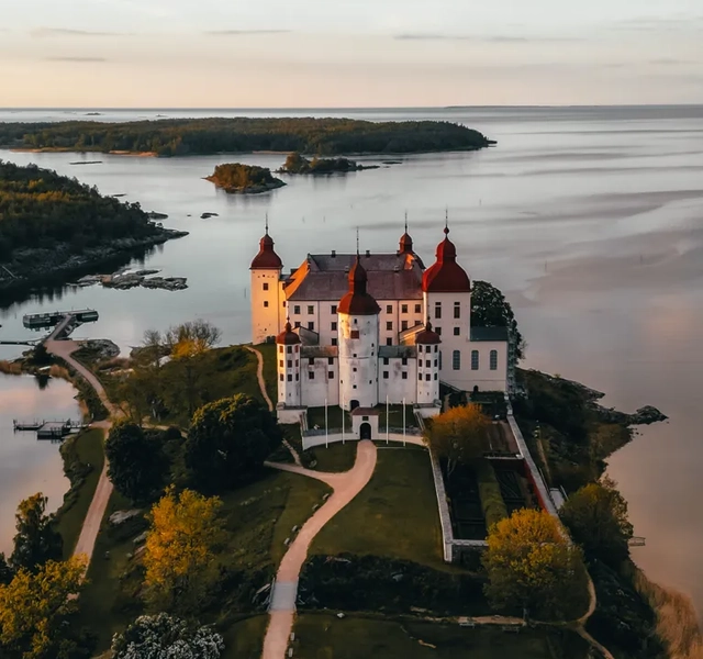 An aerial view of a castle on a small island.