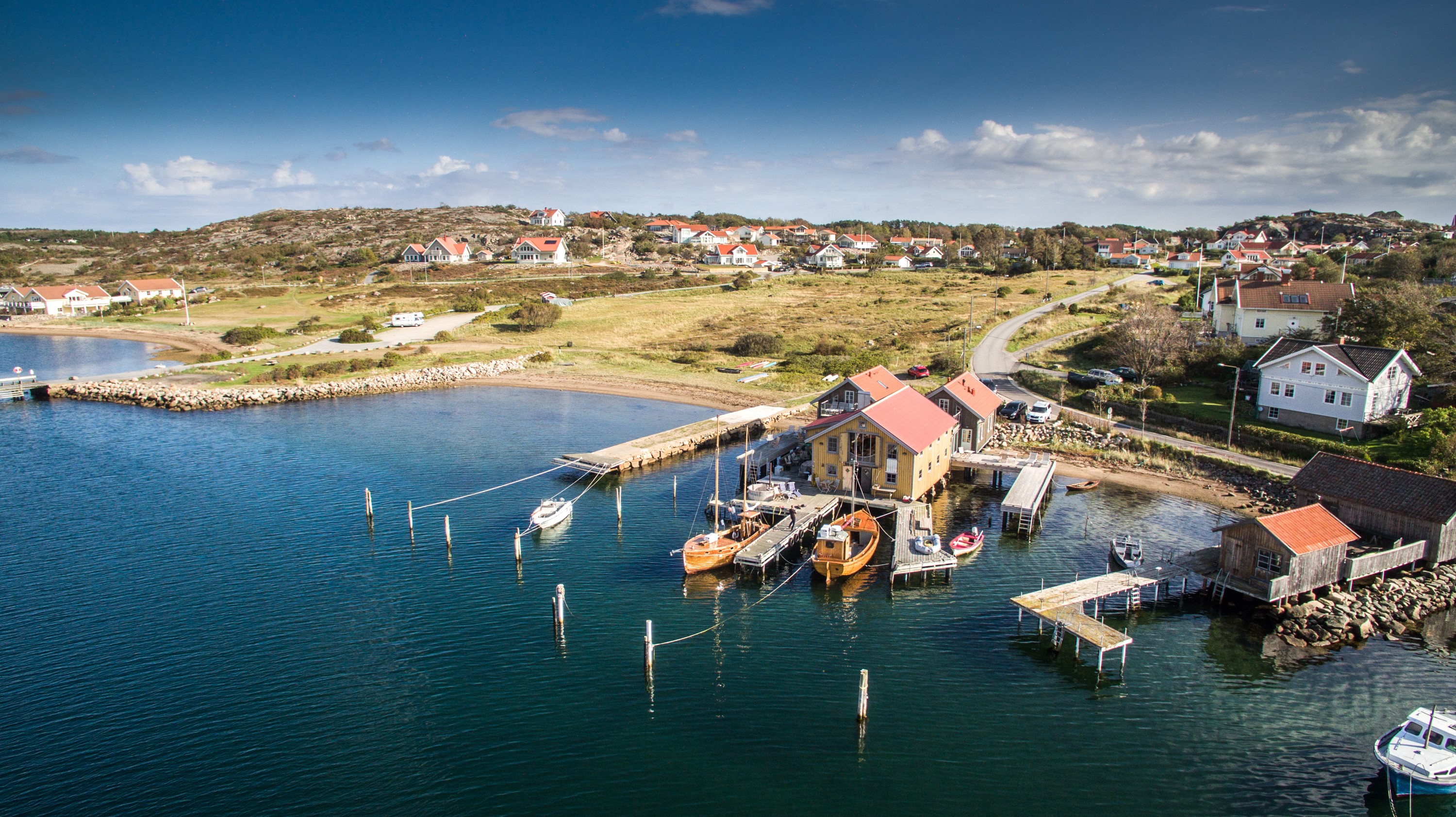 Boathouse with two boats in a harbour.