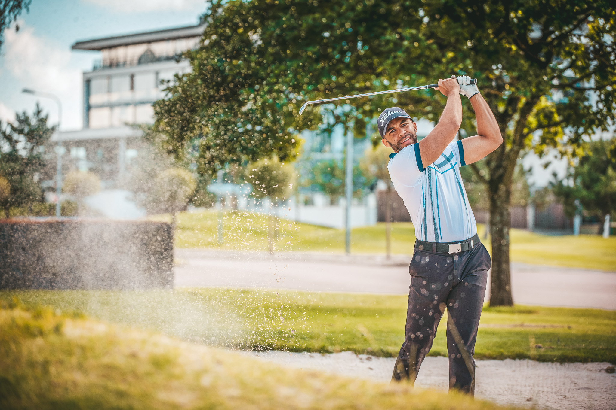 Man playing on a golf course.