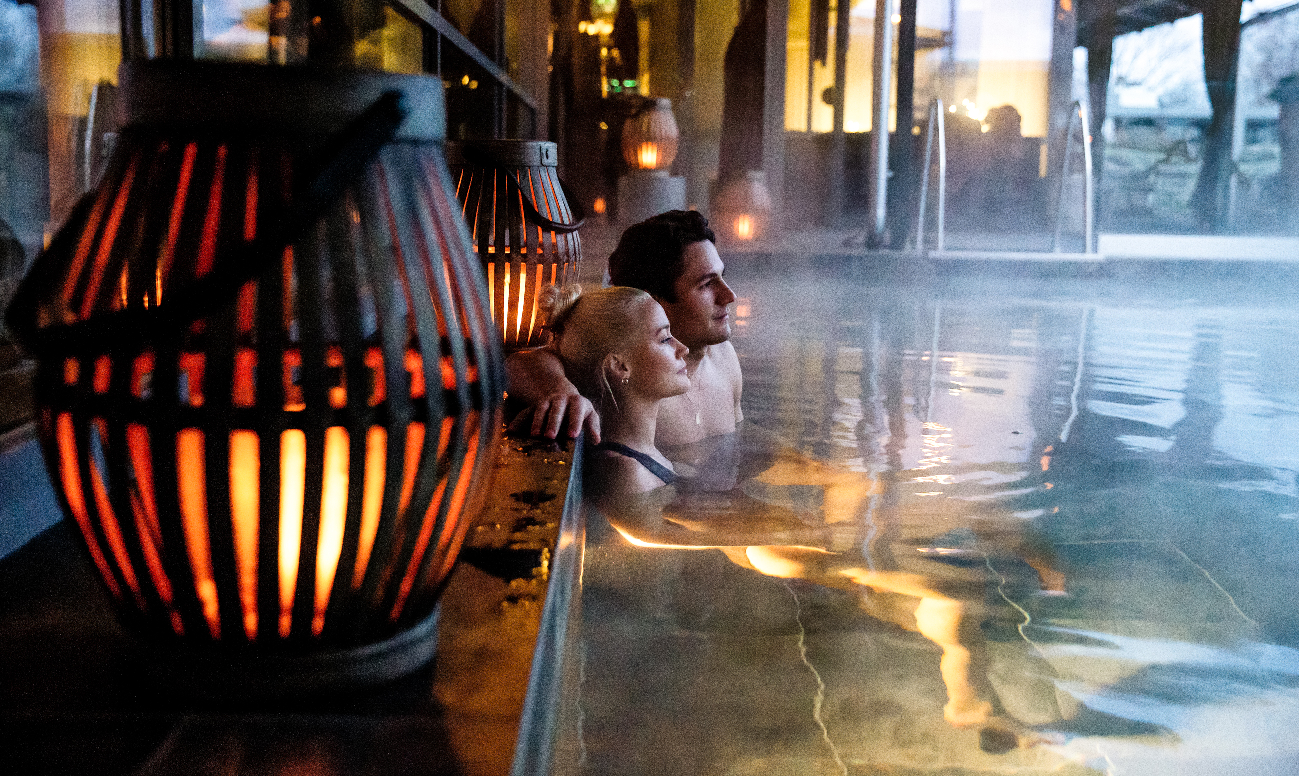Two guests in the hot pool at Arken Hotel & Art Garden Spa