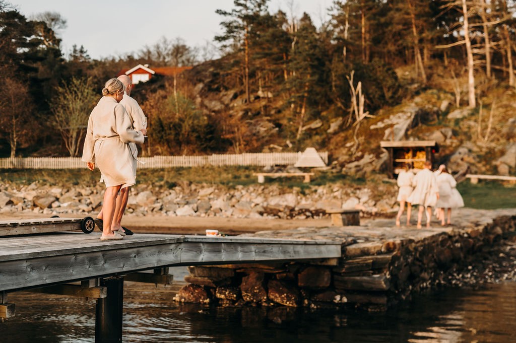 People in and around a sauna.