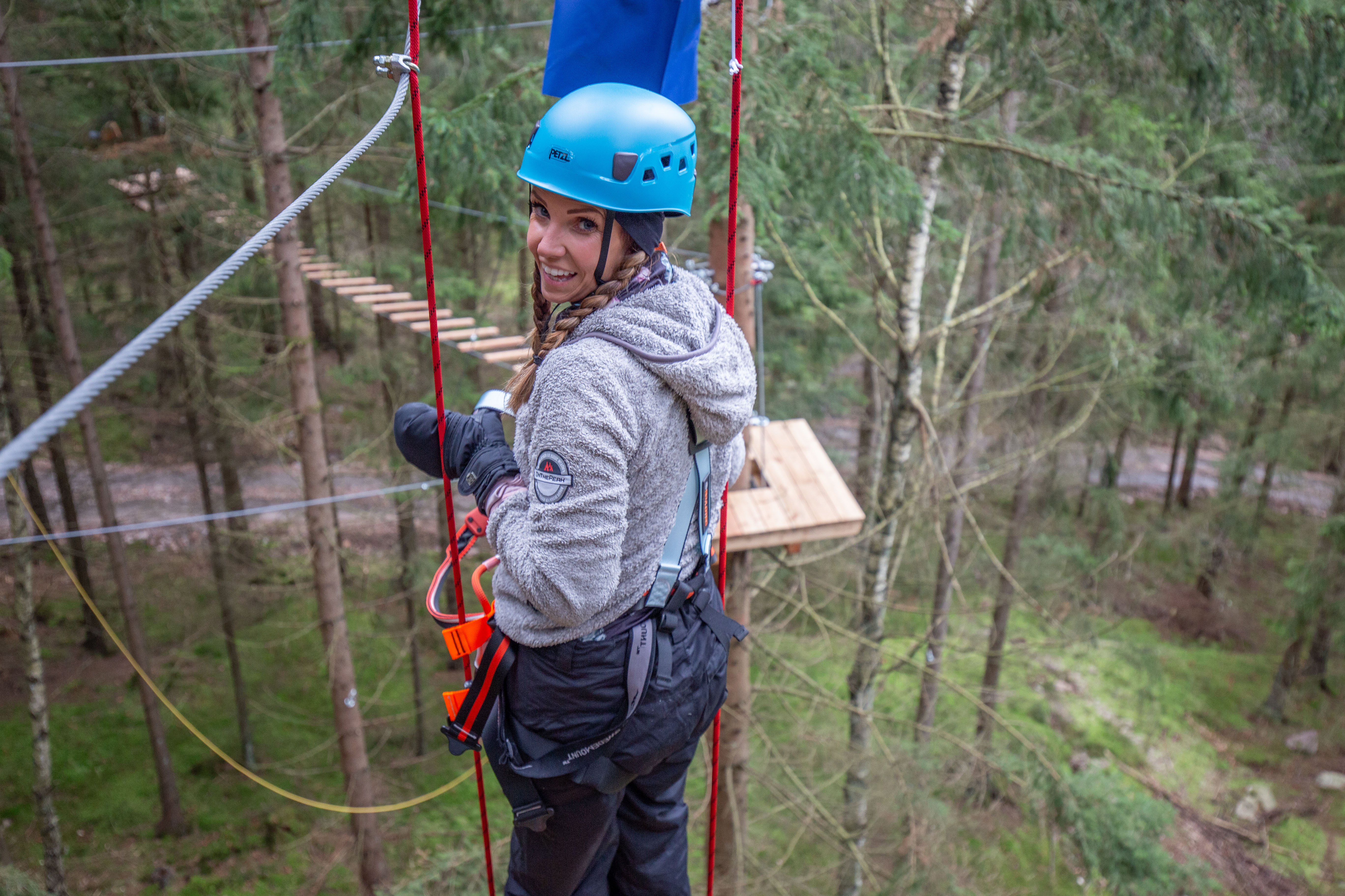 A woman climbing the high-altitude course