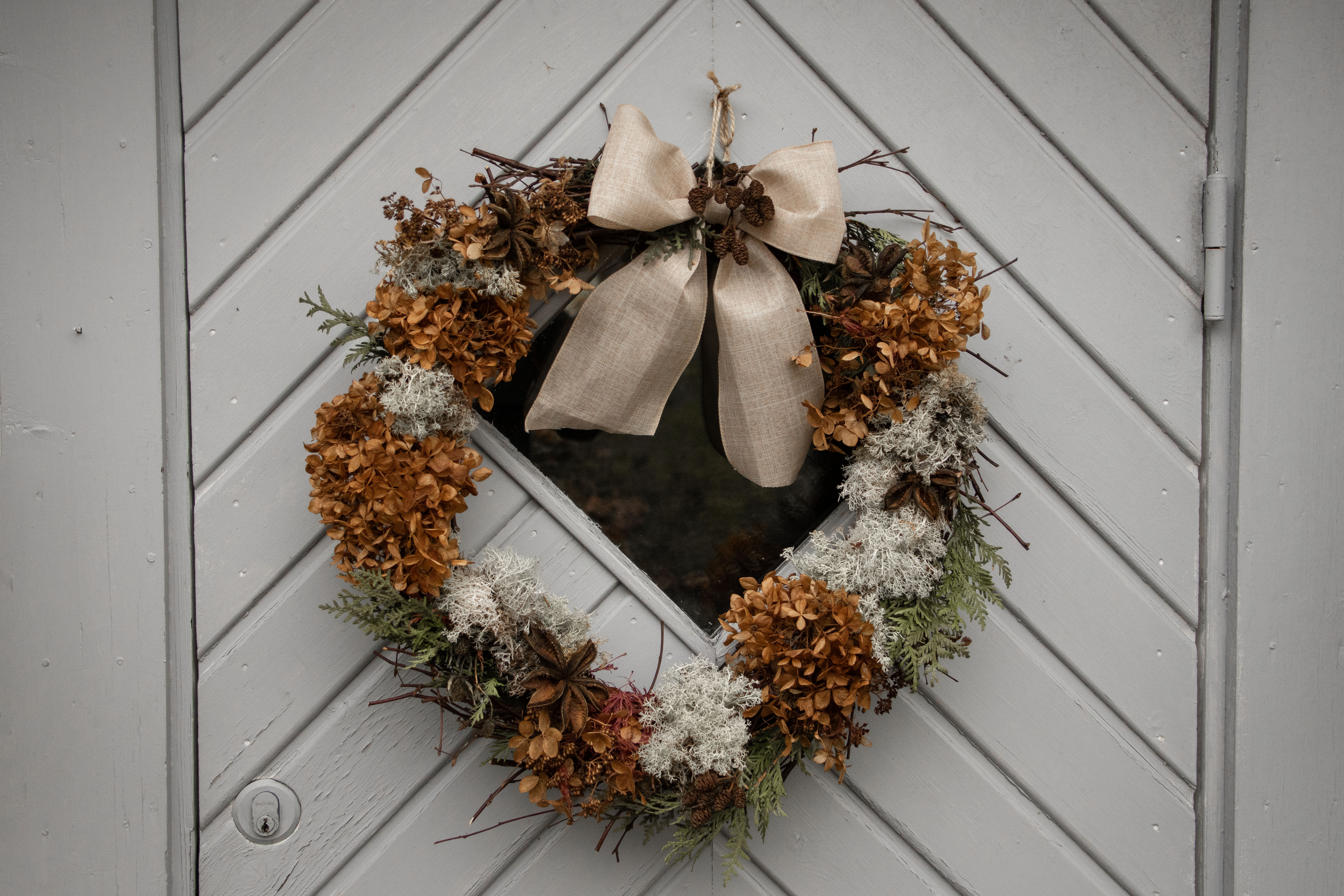 Wreath of flowers on a door.