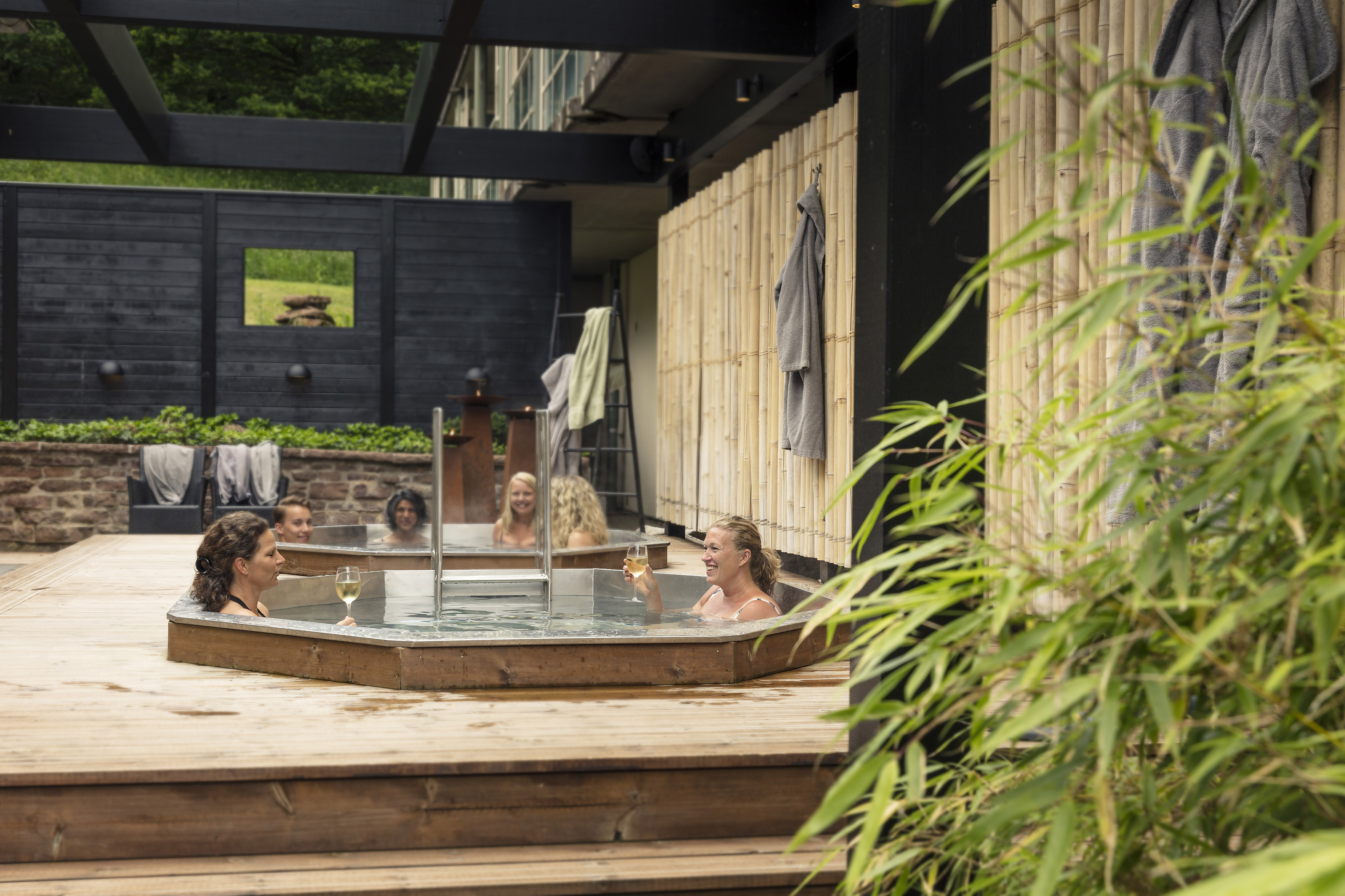 Women sitting in a hot tub.