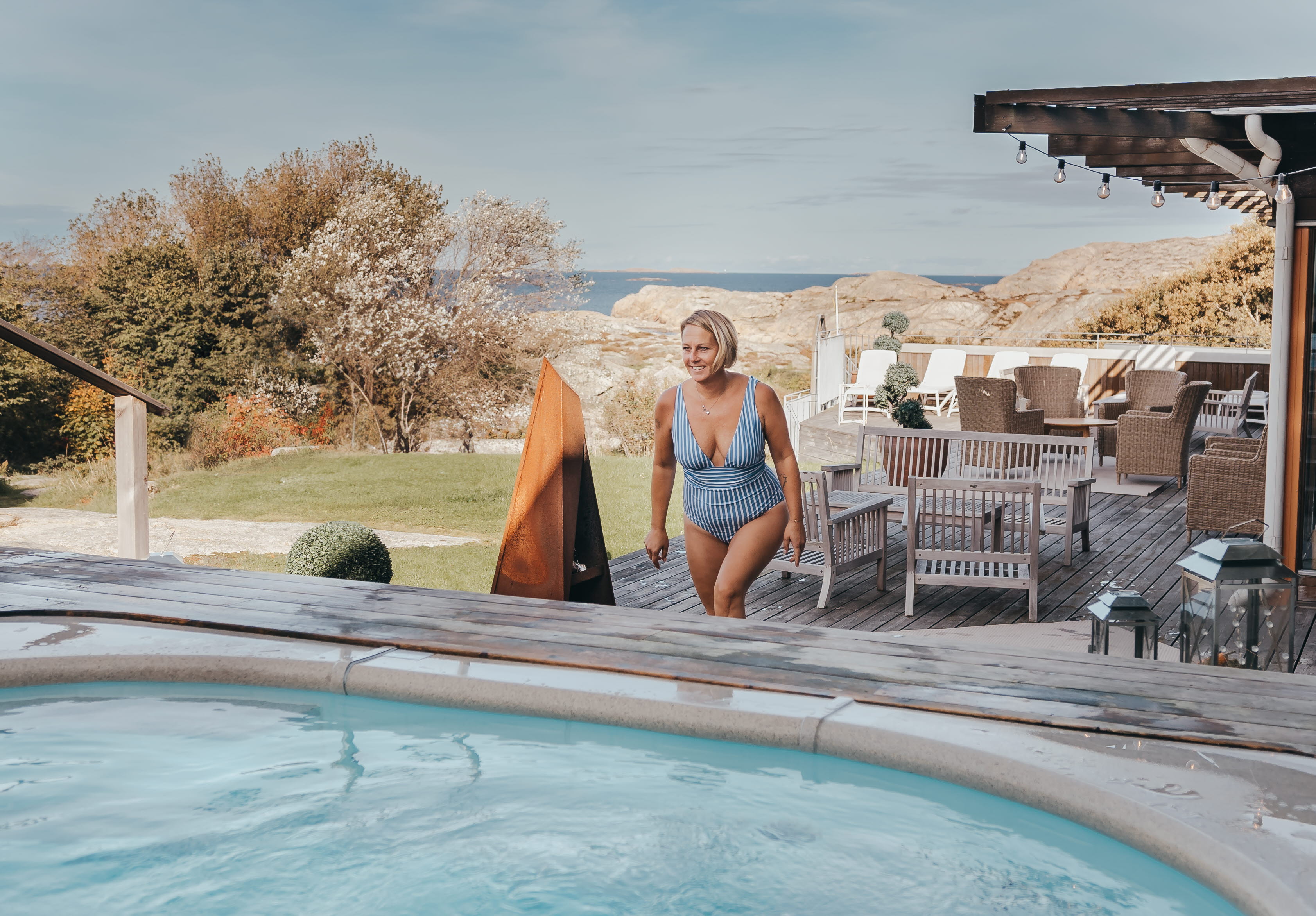 Woman at the spa terrace outdoor pool at Hotel Smögens Hafvsbad