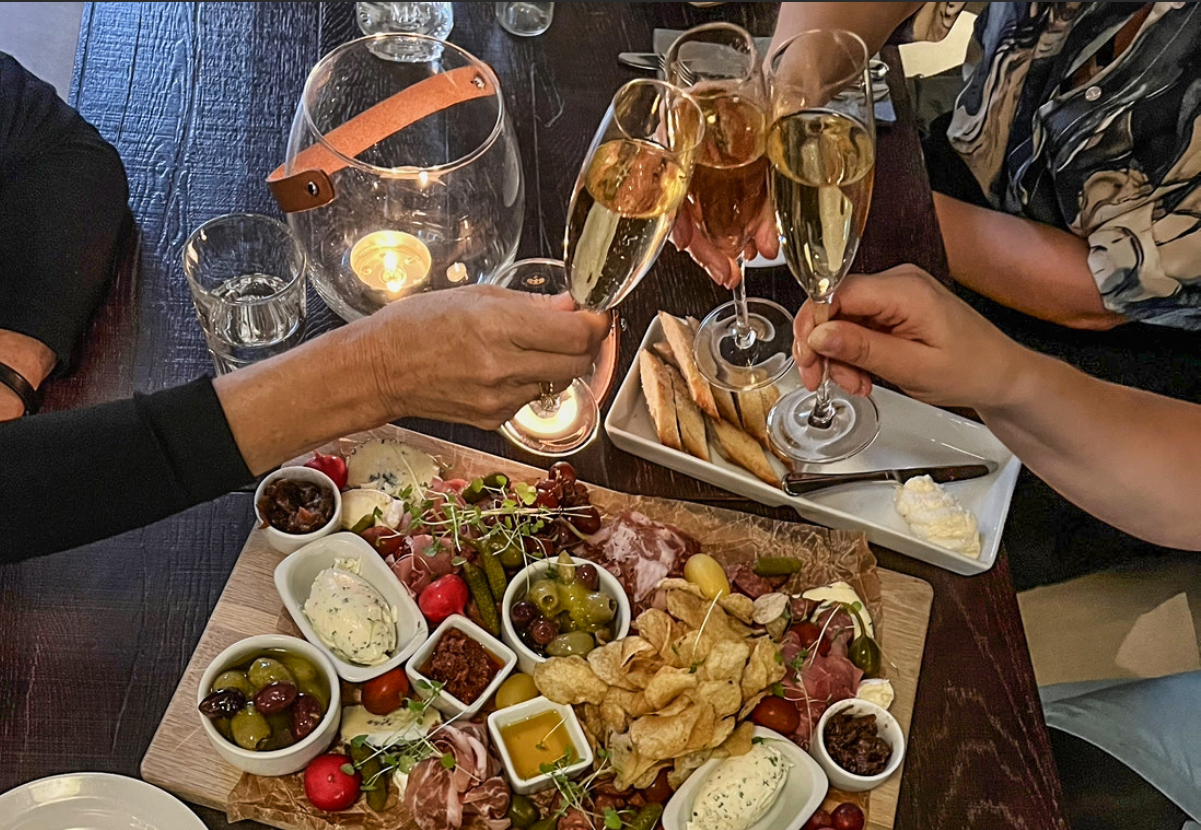 A delicious dish and guests toasting in Champagne, Best Western Plus Edward Hotel