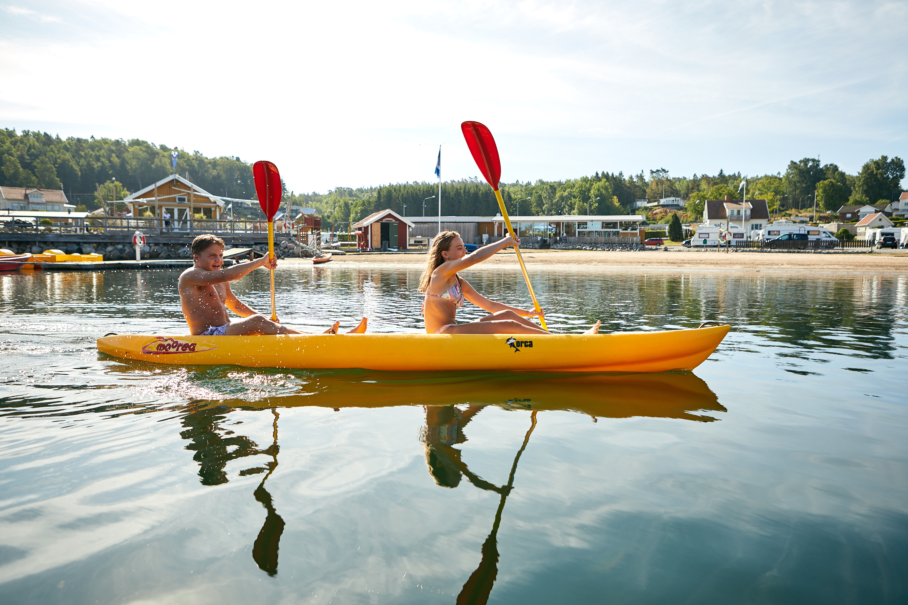 Kayakers crossing the waters at Lagunen Camping & Stugor