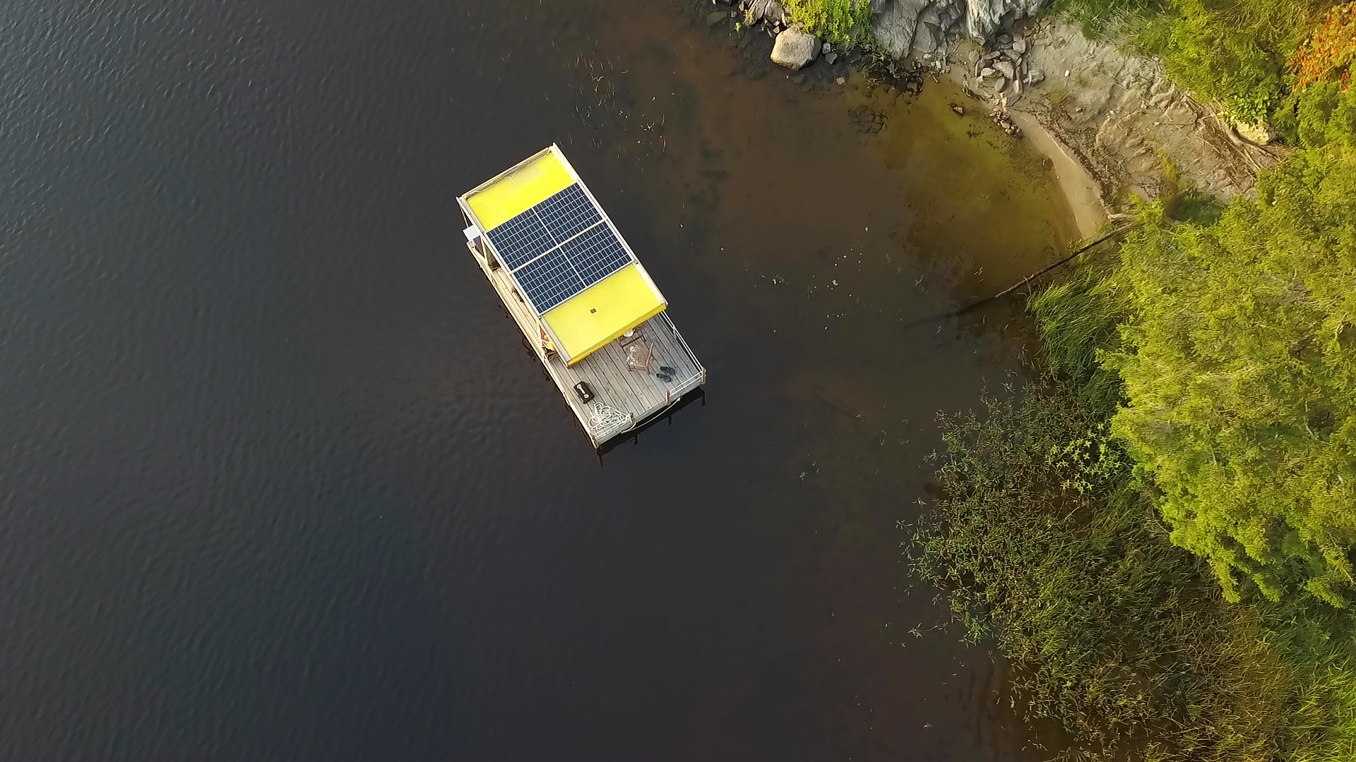 Raft in a lake, where the picture is taken from above.