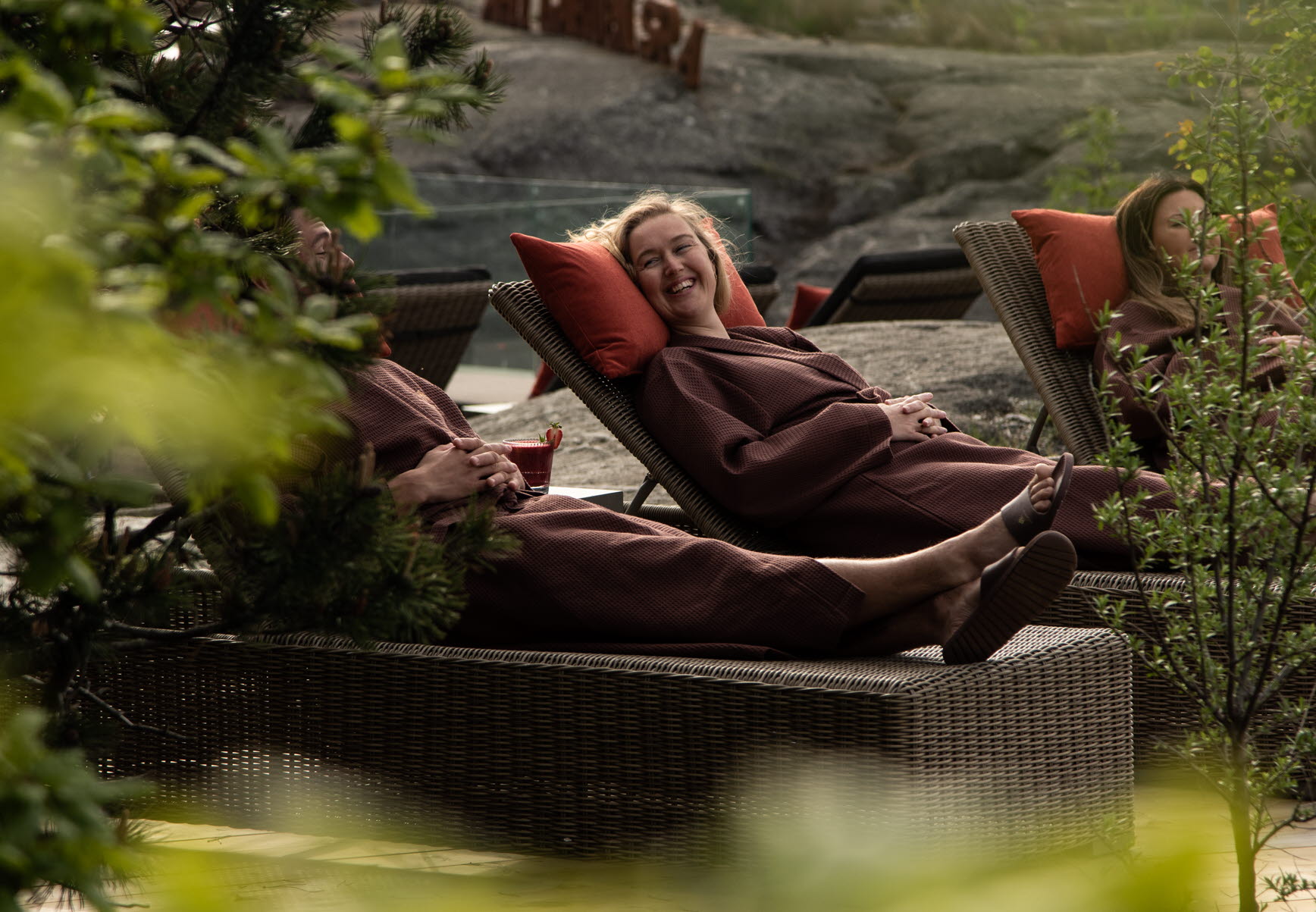 Spa guests resting in deckchairs at Arken Hotel & Art Garden Spa