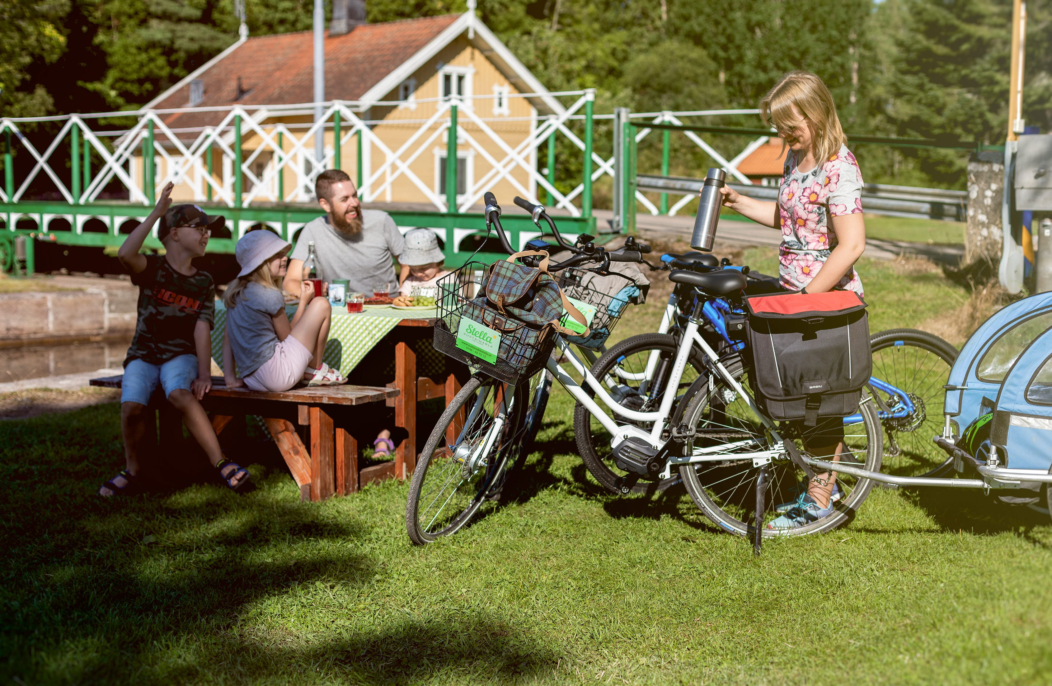 People bicycling along Göta kanal.