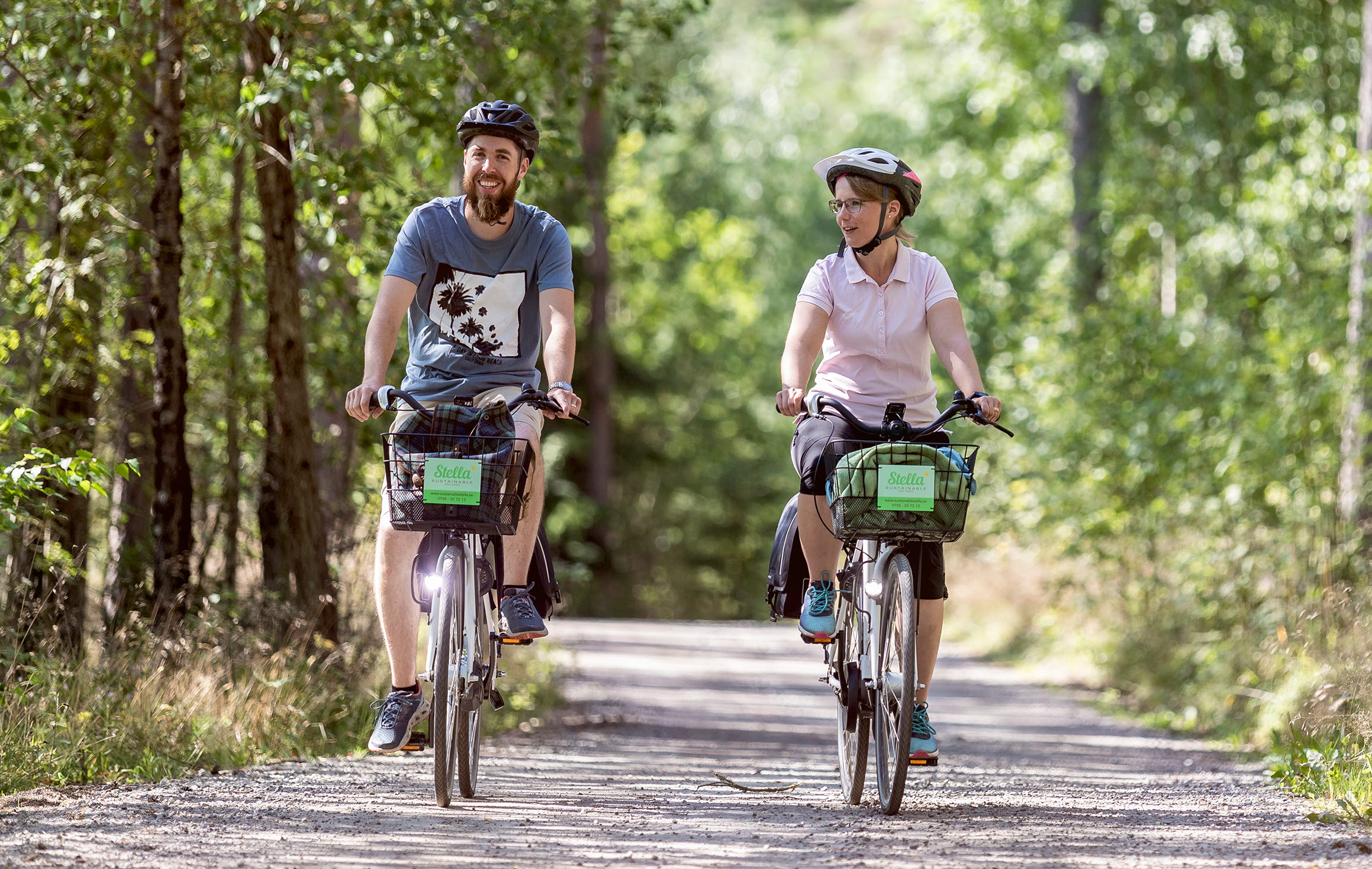People bicycling along Göta kanal.