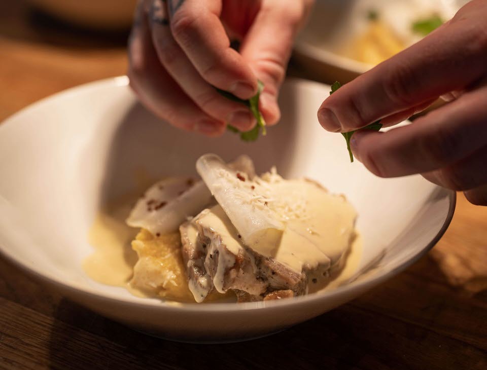 Dish preparation in the restaurant at Tofta Herrgård