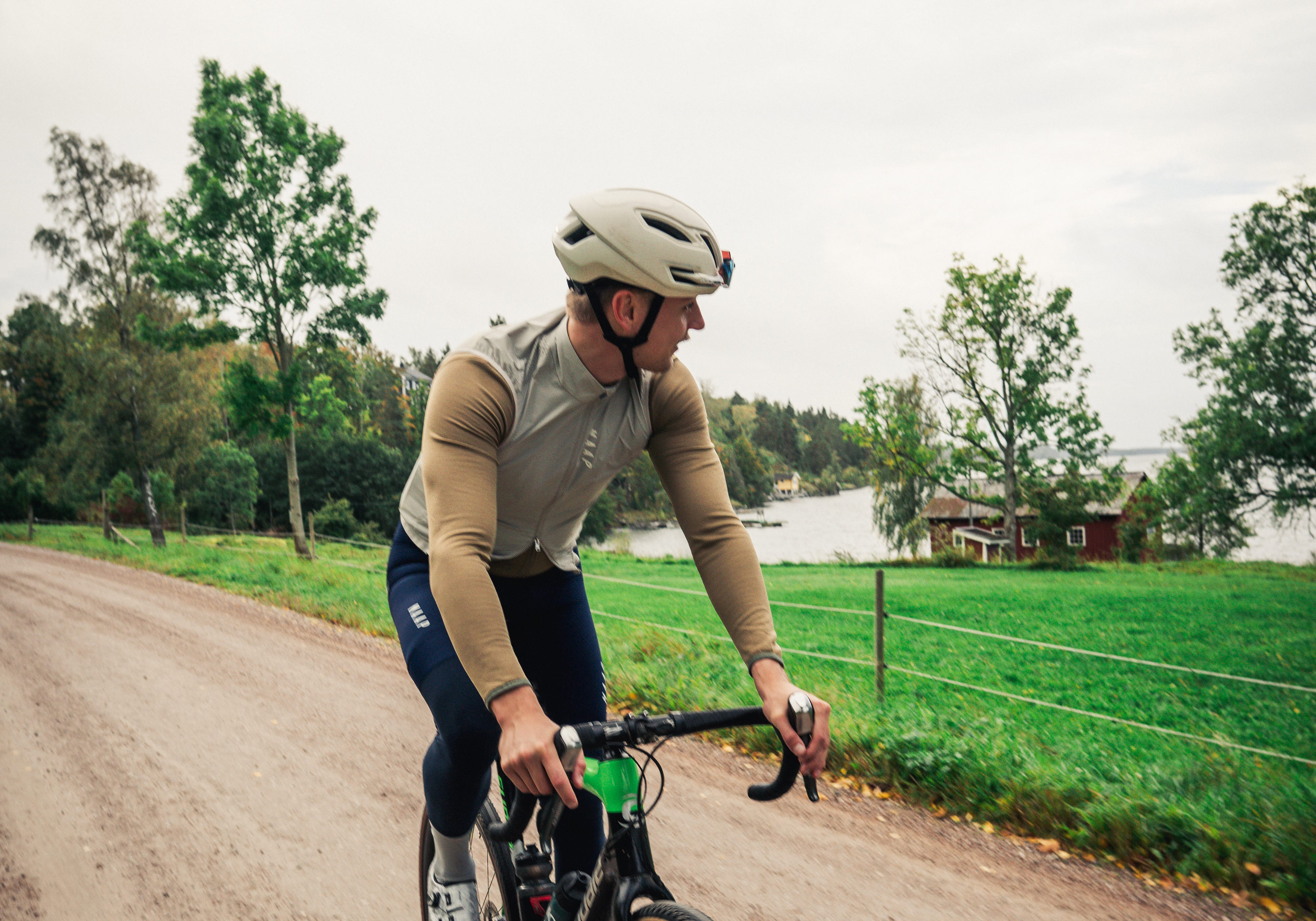 Cyclist on a dirt road in the forest.