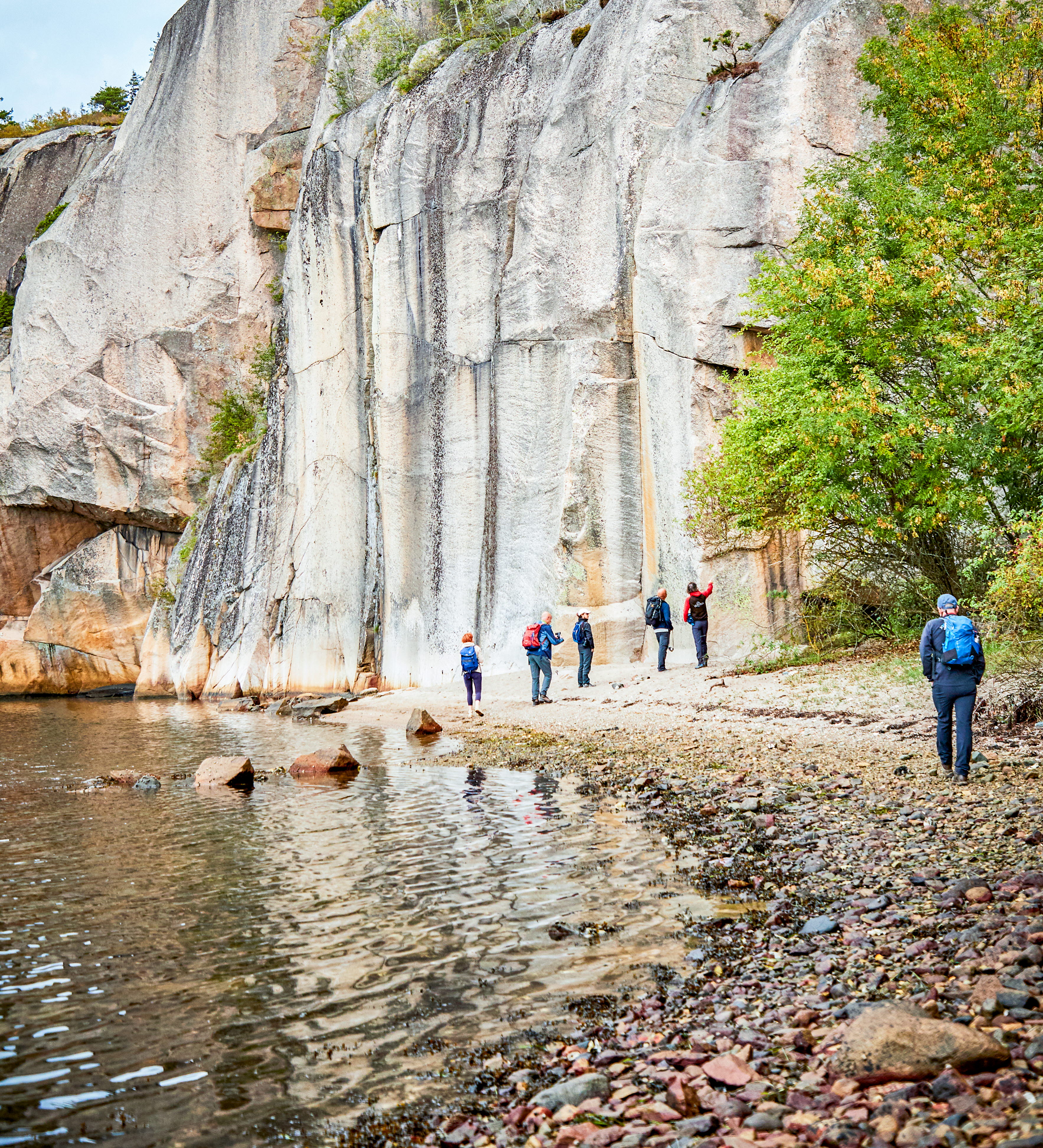 Hiker in the nature by a fjord.