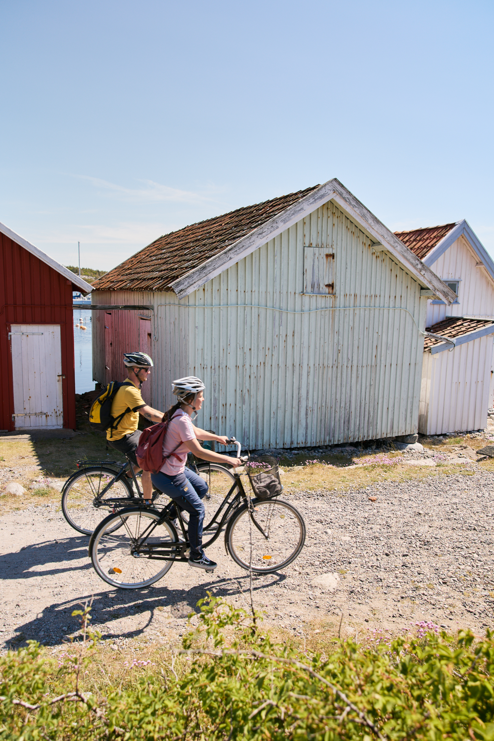 Two people are cycling on an island.