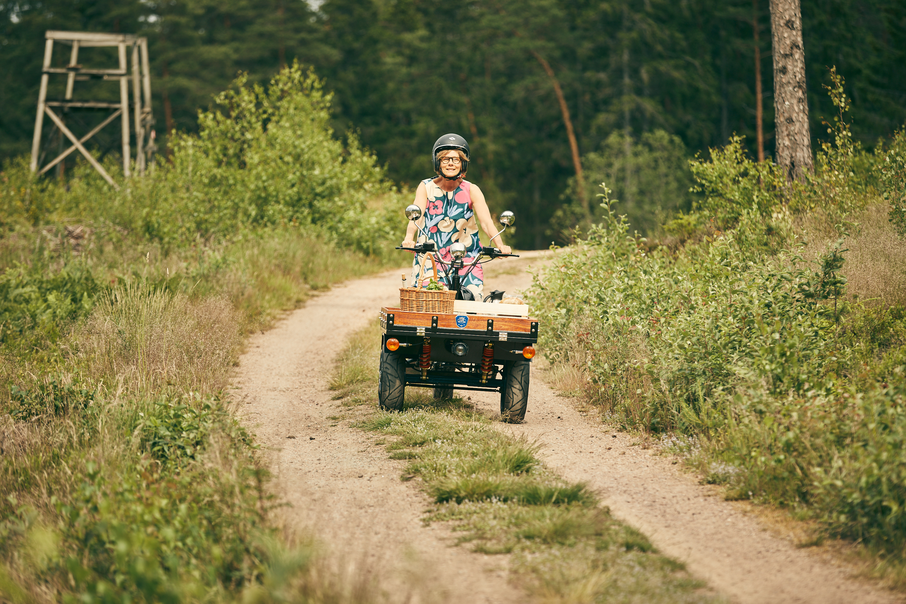 Elisabeth drives her moped
