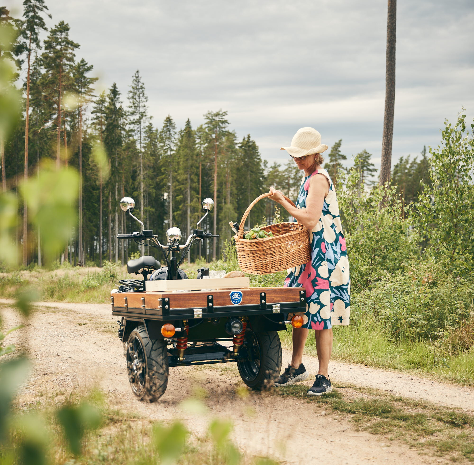 Elisabeth drives her moped