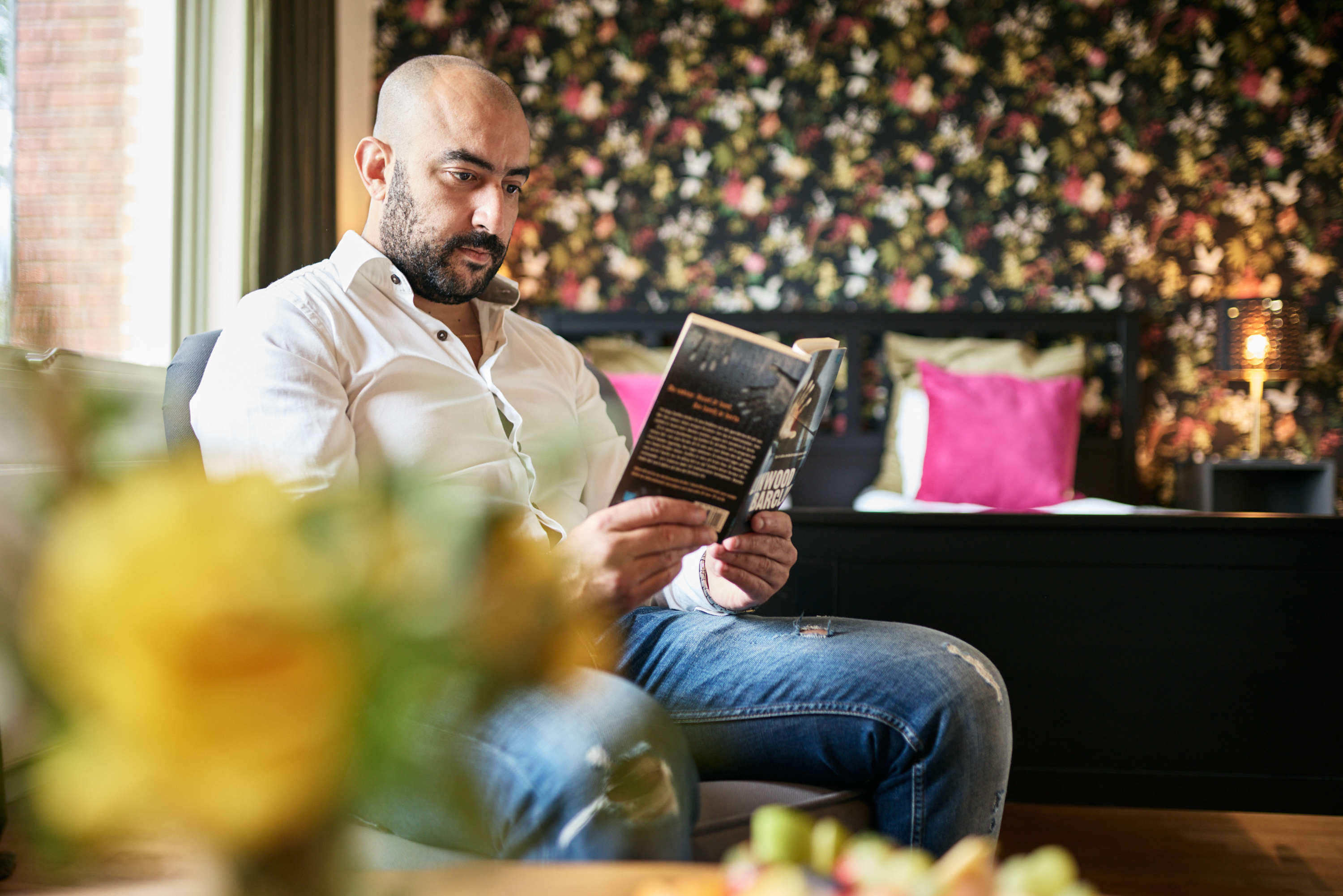 A man reading at First Hotel Bengtsfors