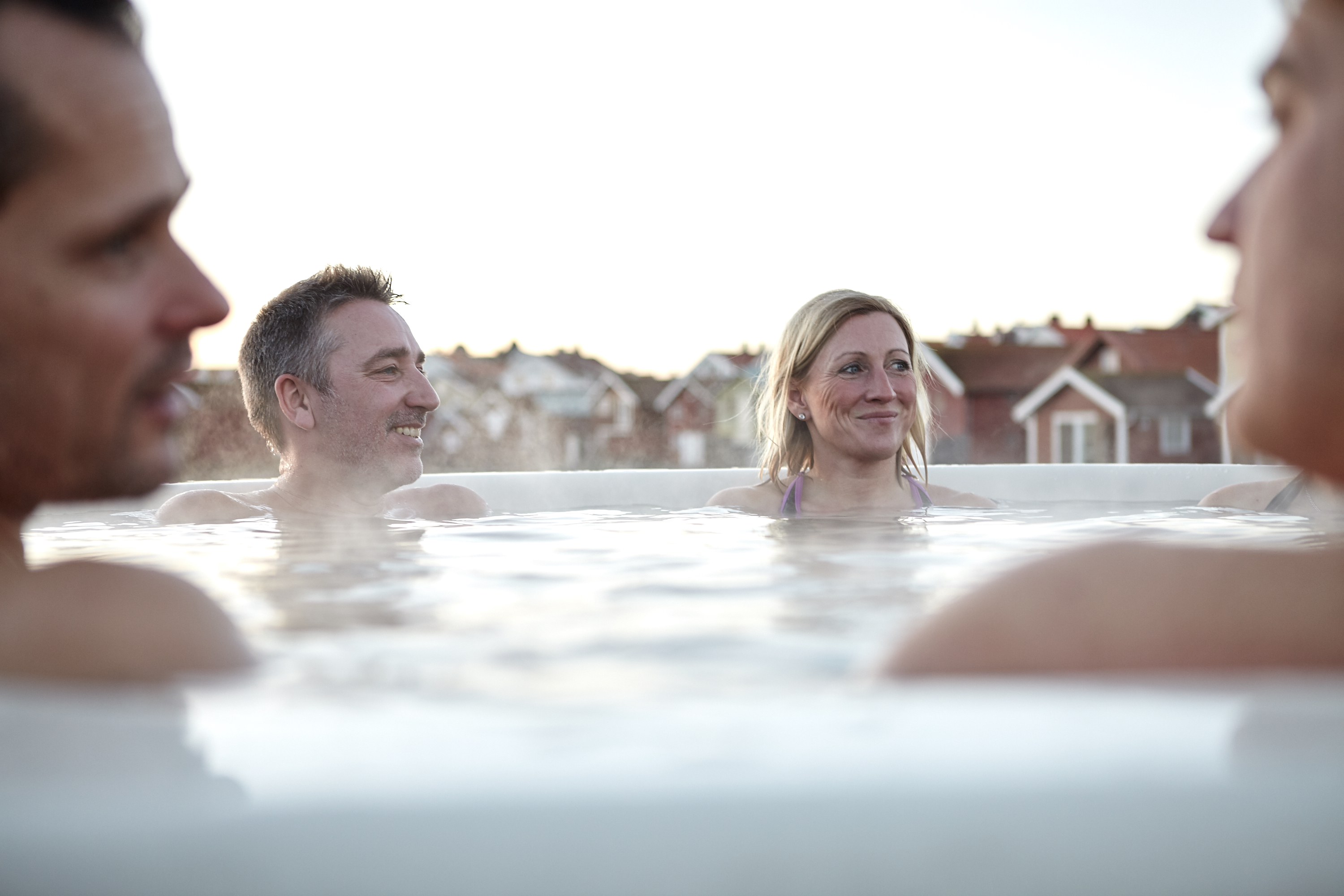 Group of people sharing a bath in a hot tub at Smögen in winter time