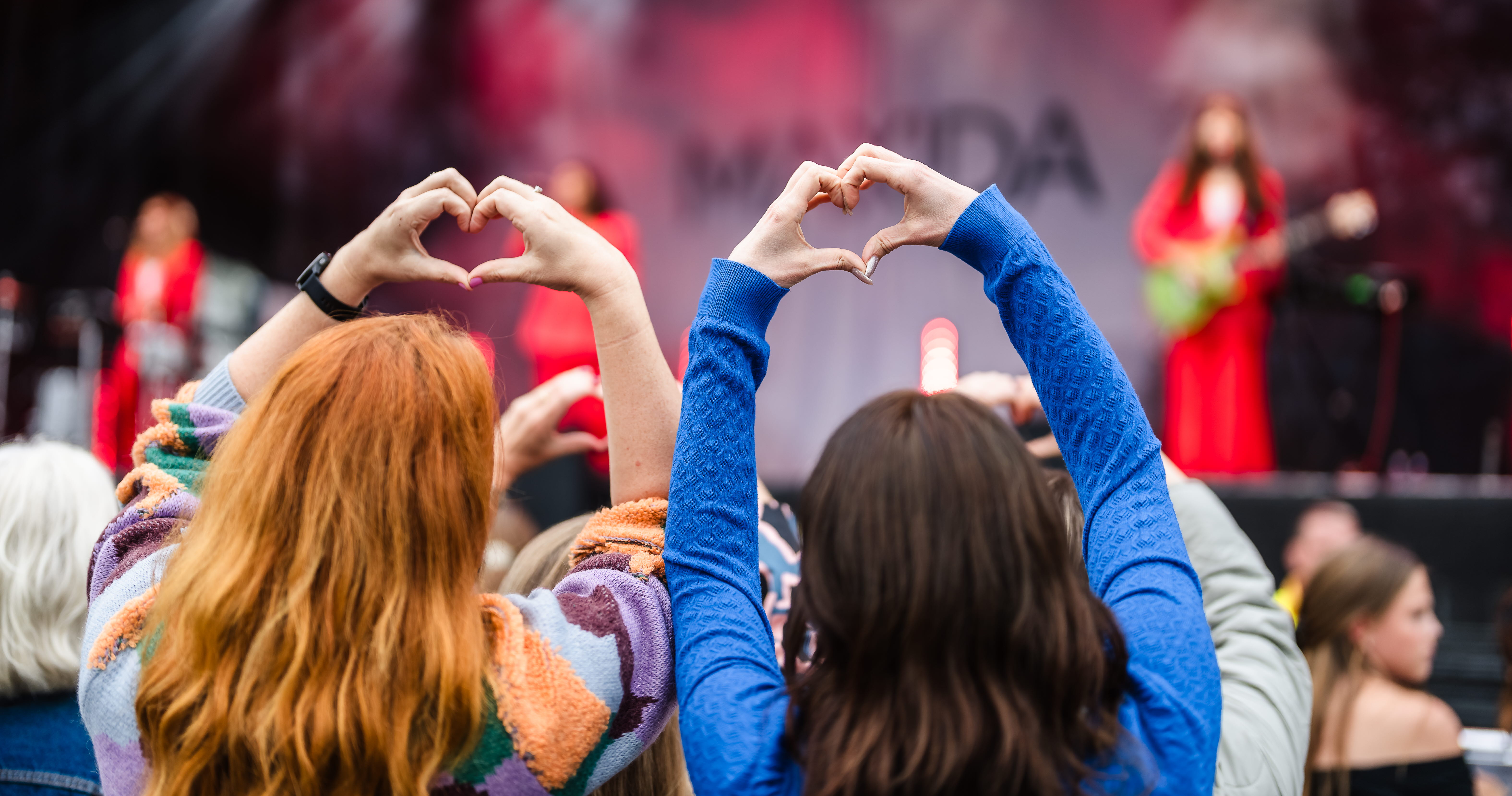 Friends having fun at a music festival.