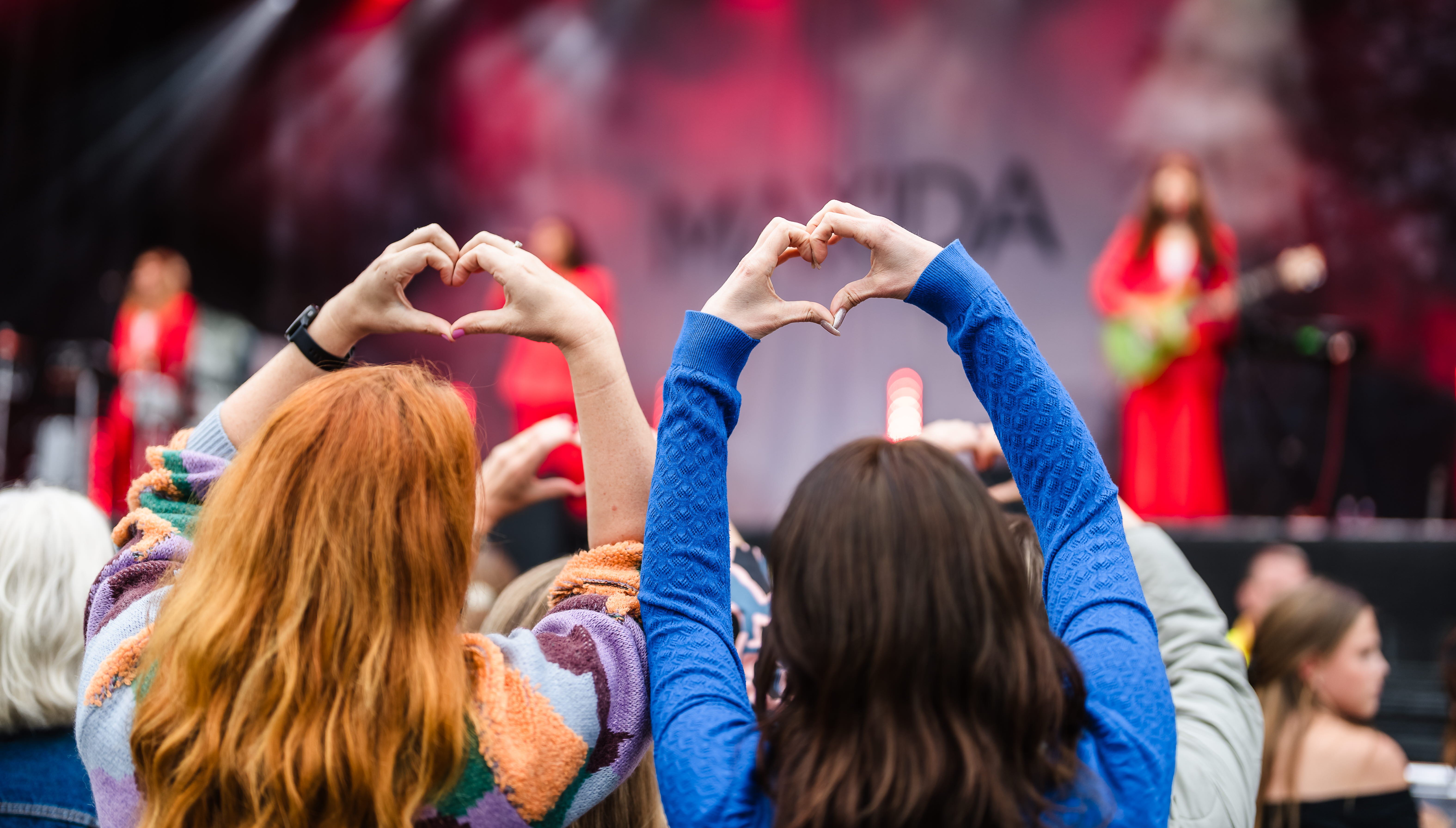 Friends having fun at a music festival.