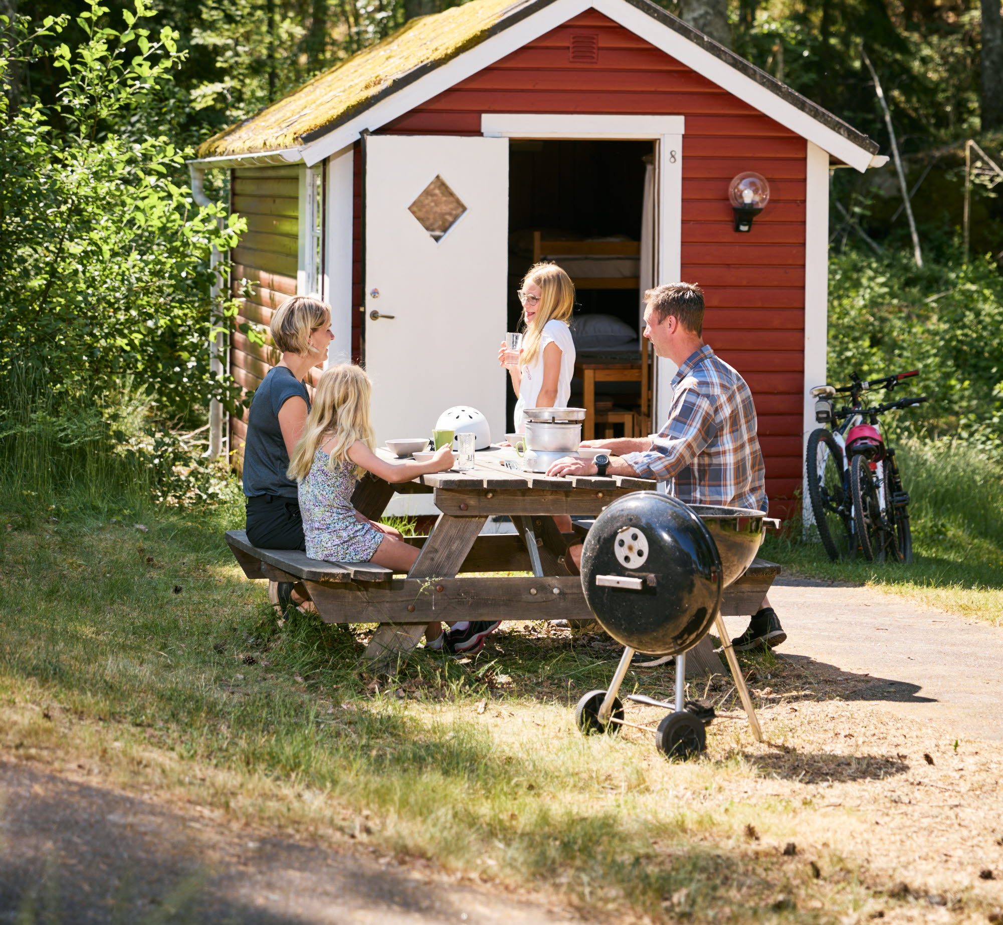 Family at a camping cabin.