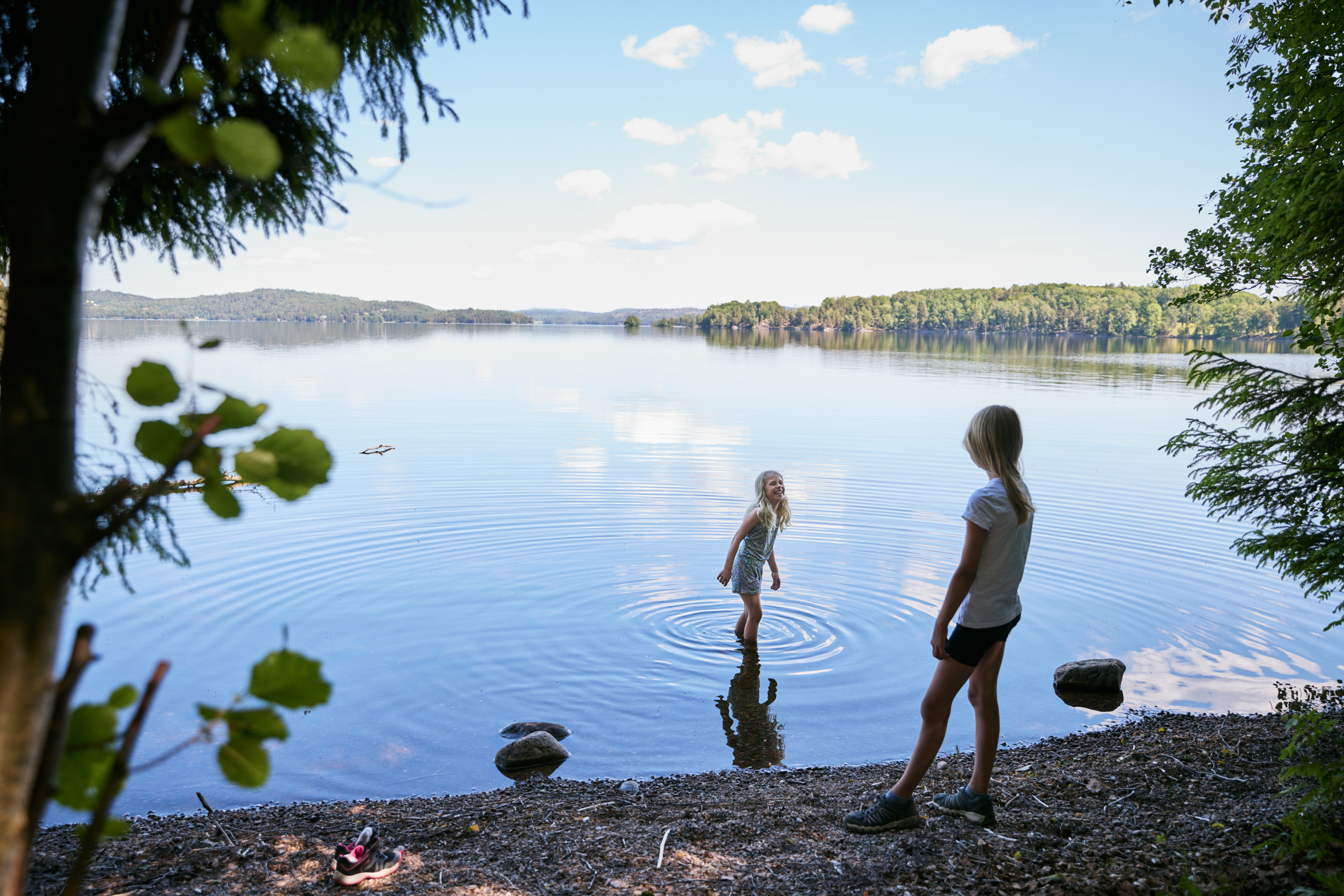 Children by a lake.