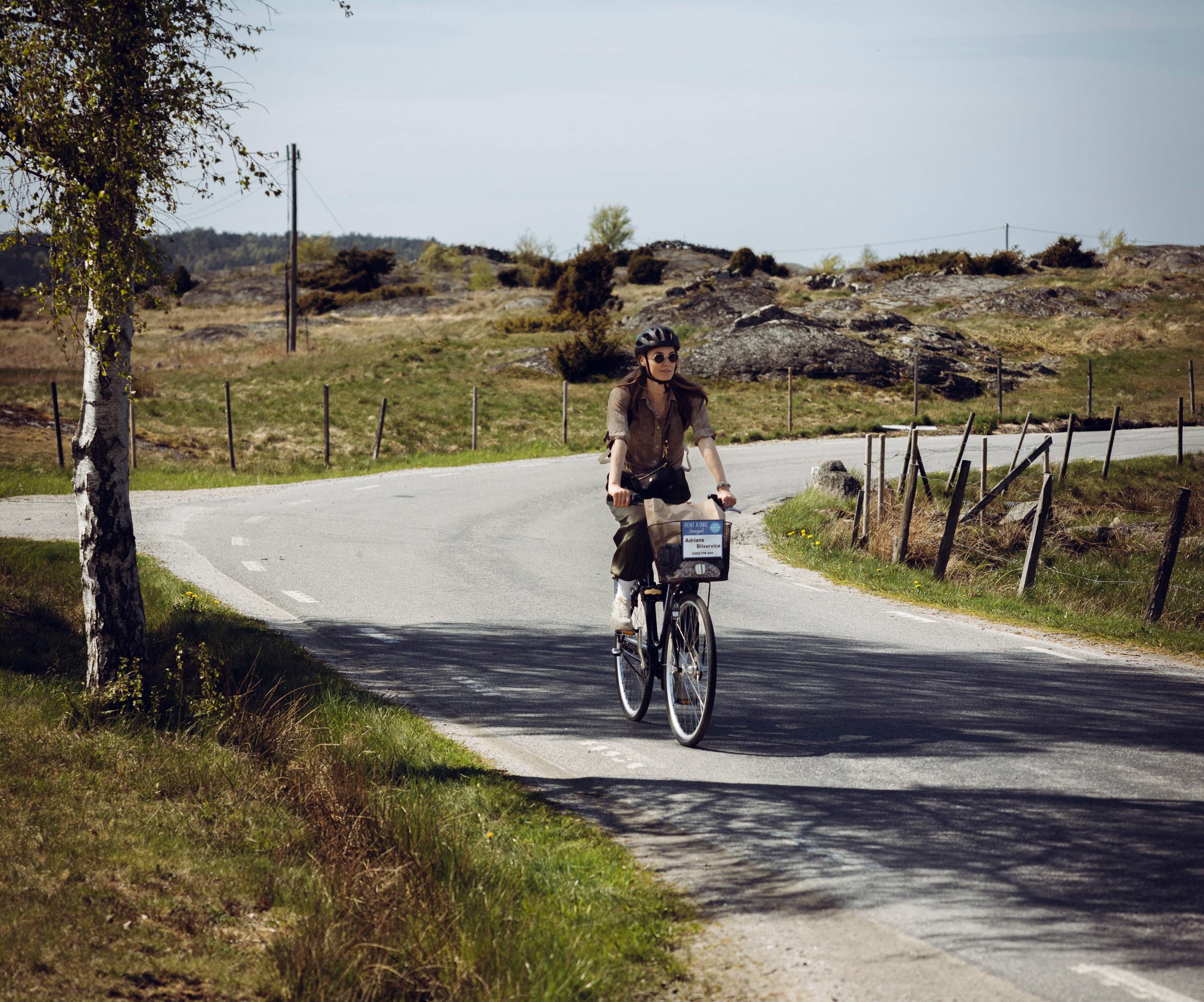 Woman on cycling holiday in West Sweden.