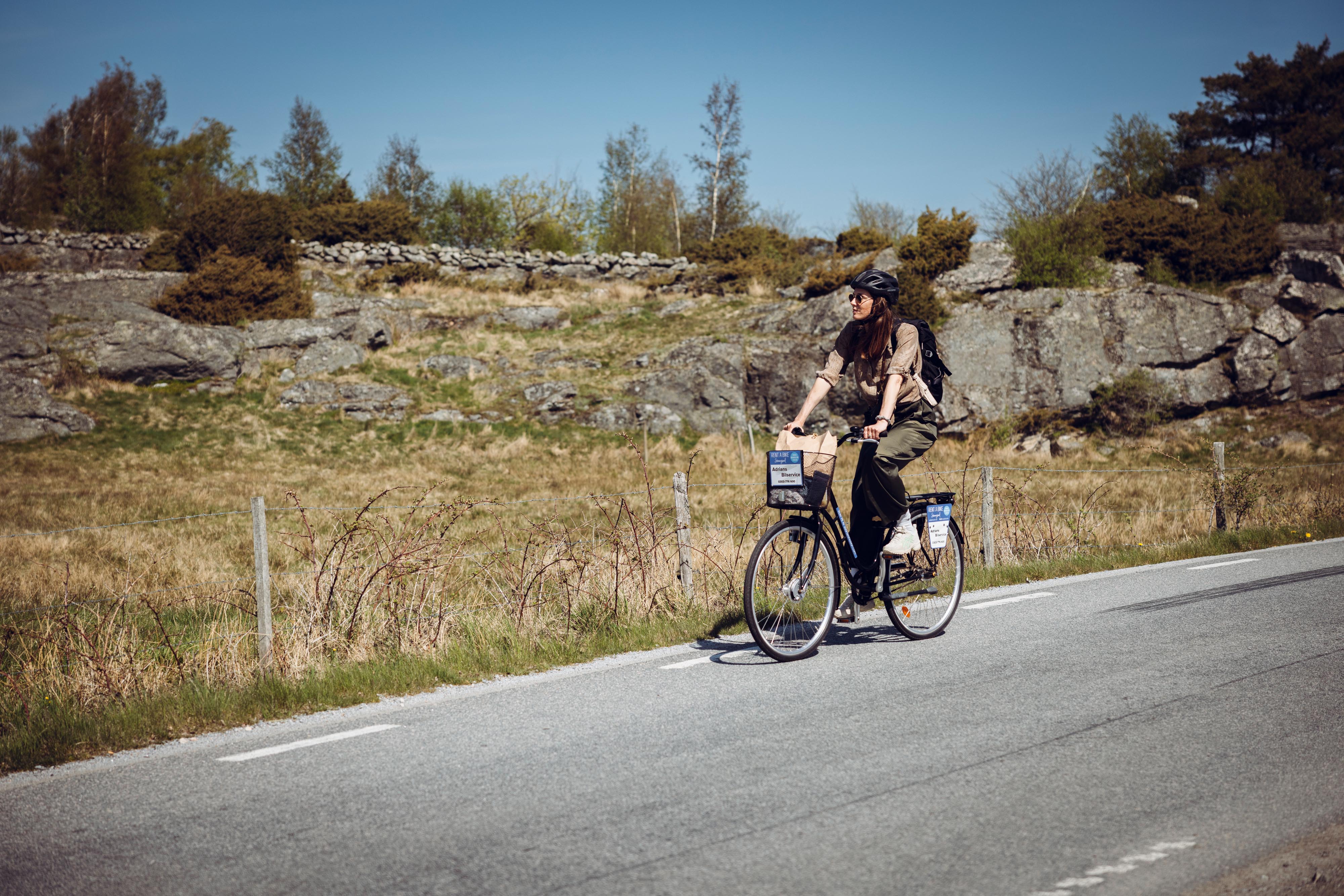 Woman on cycling holiday in West Sweden.