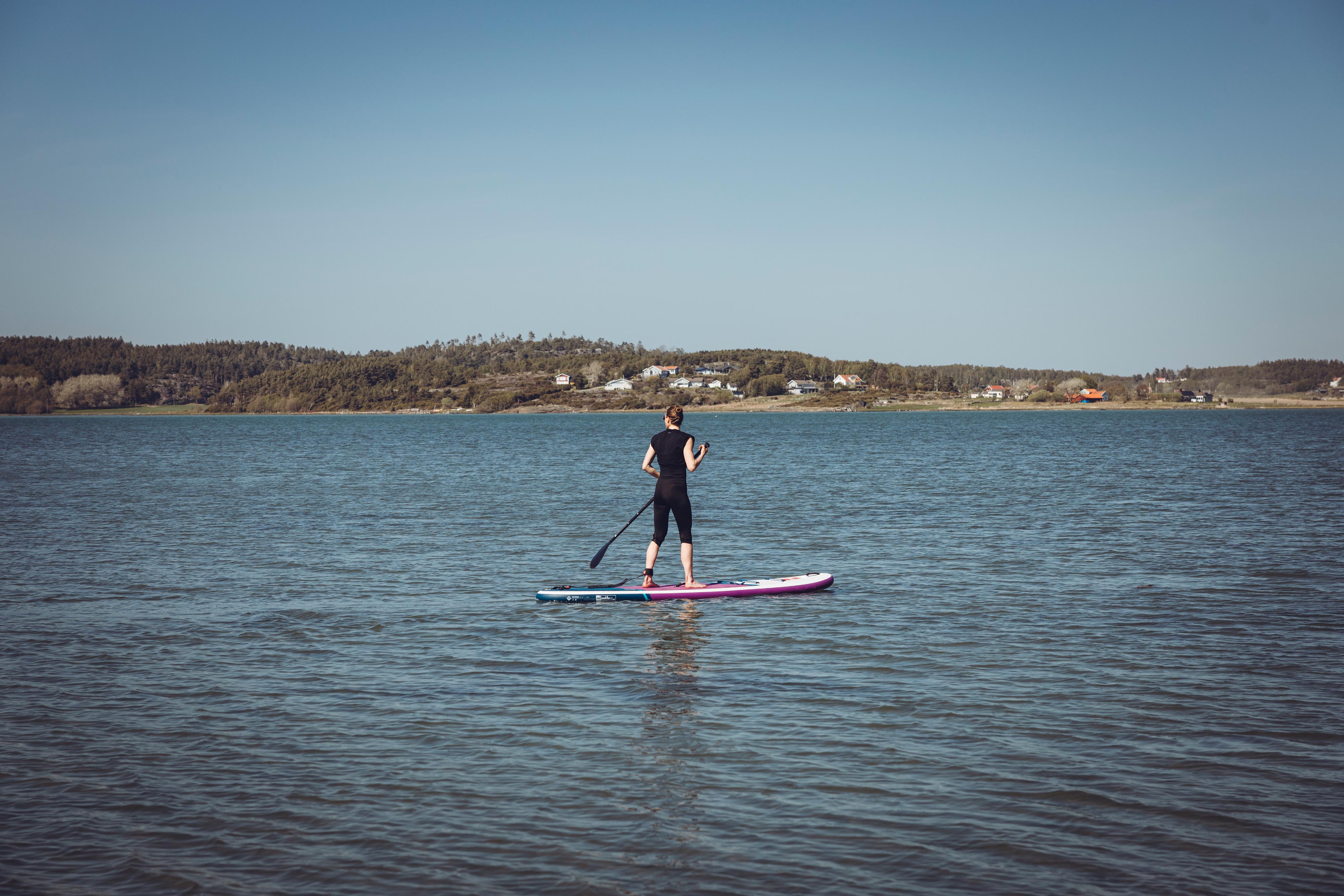 Woman on a stand up paddleboard.