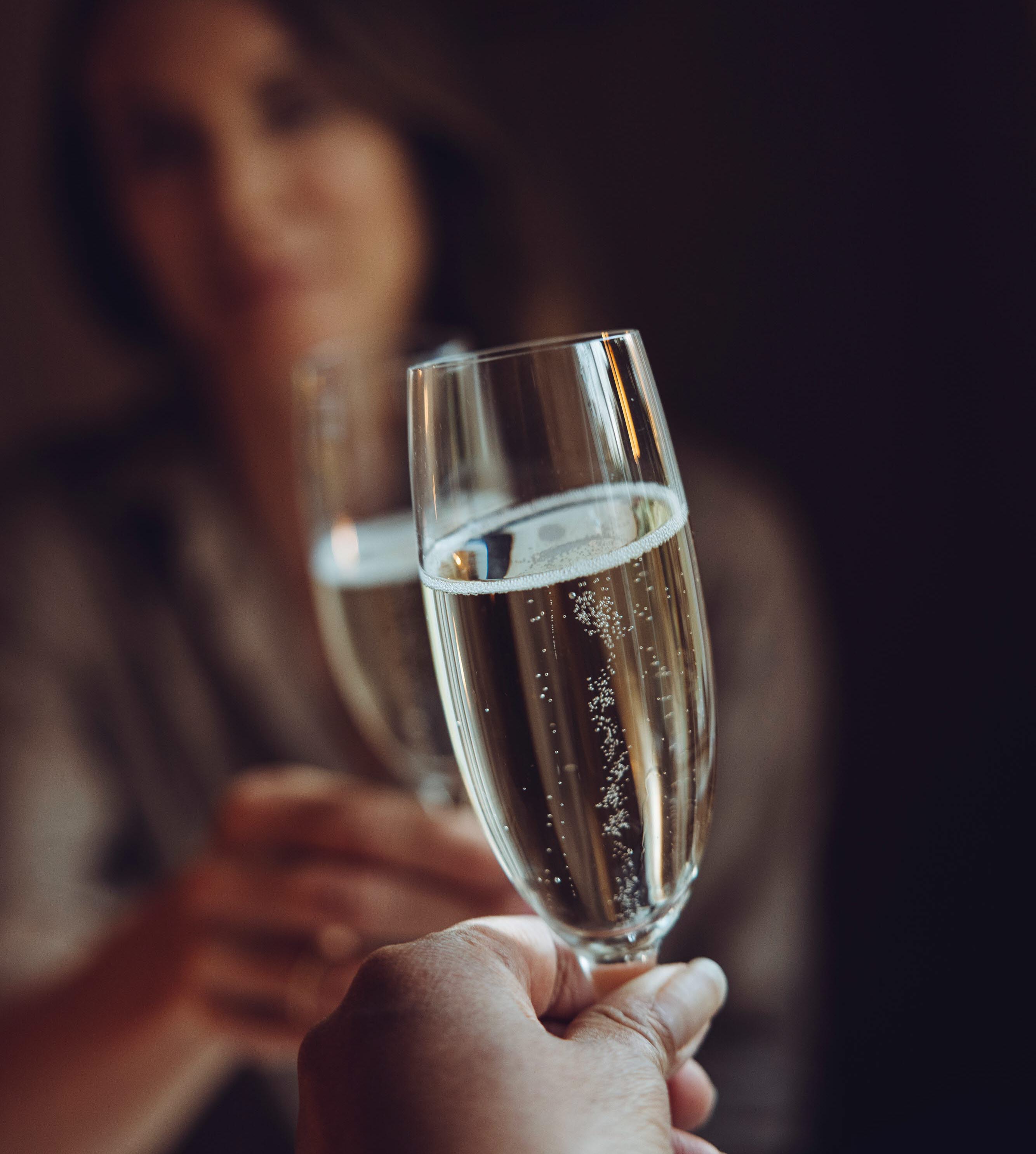Hands holding glasses and bowls