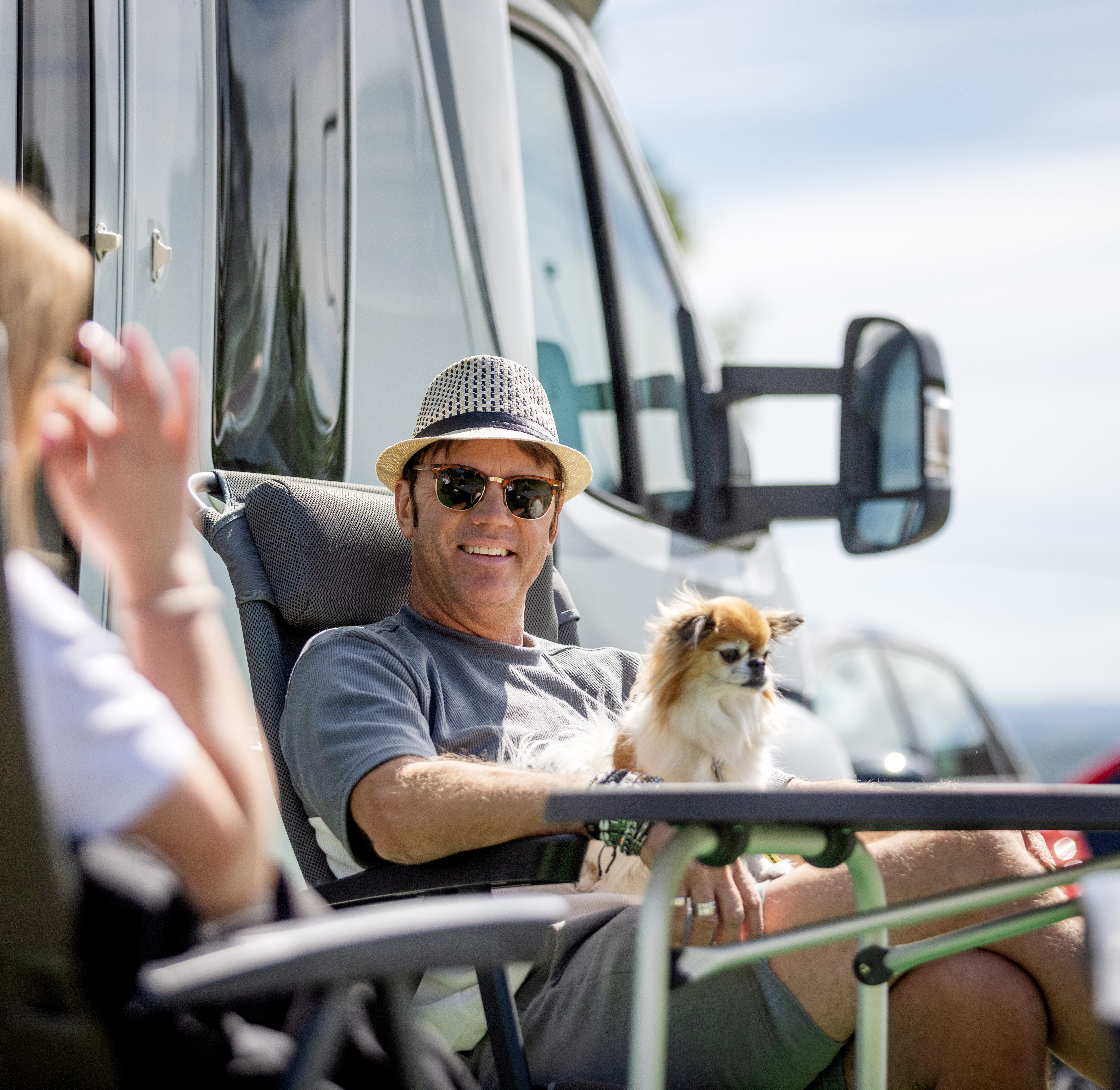 People hanging out at a campsite.