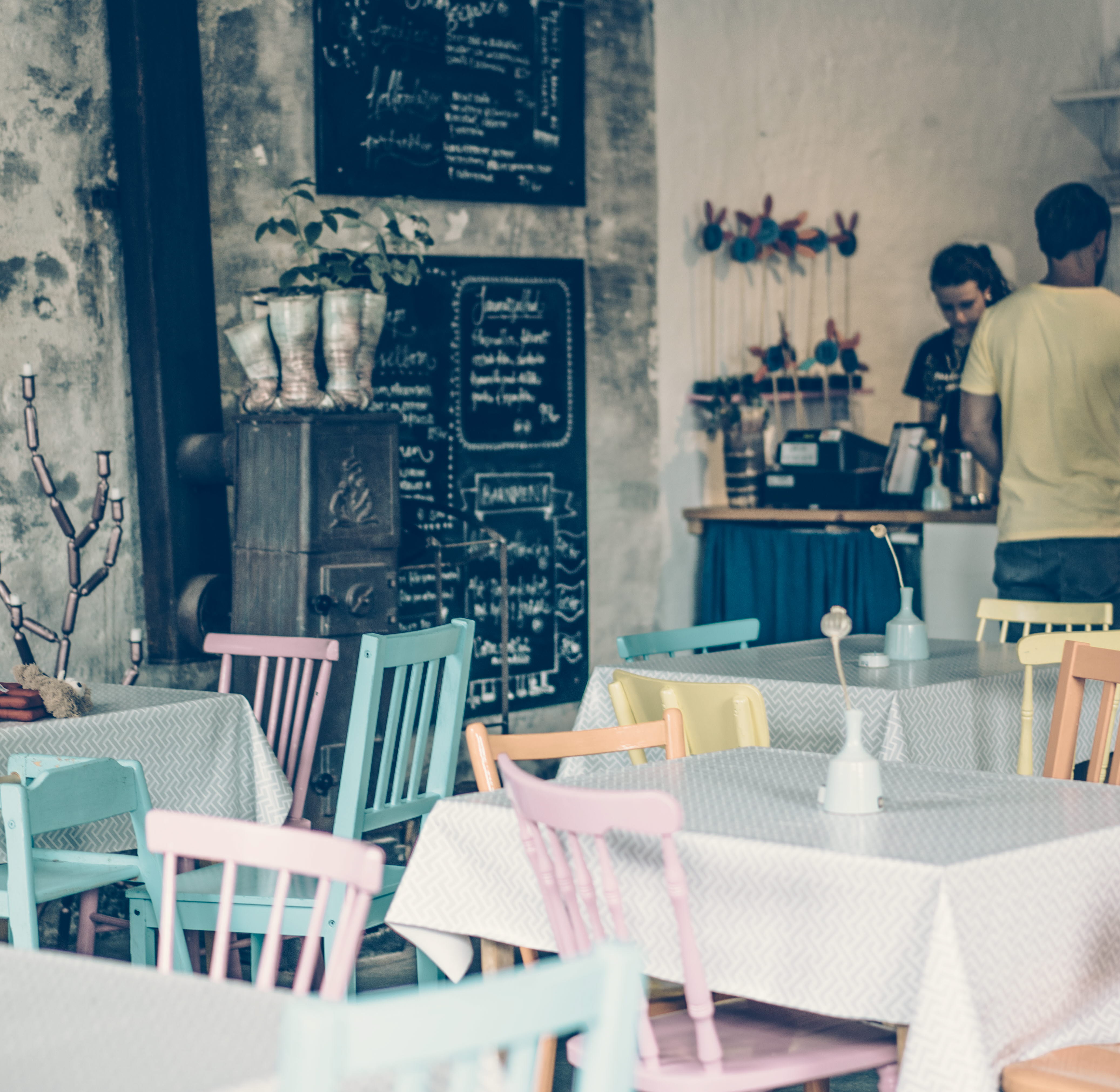 Colorful chairs and tables inside the cafe Not Quite