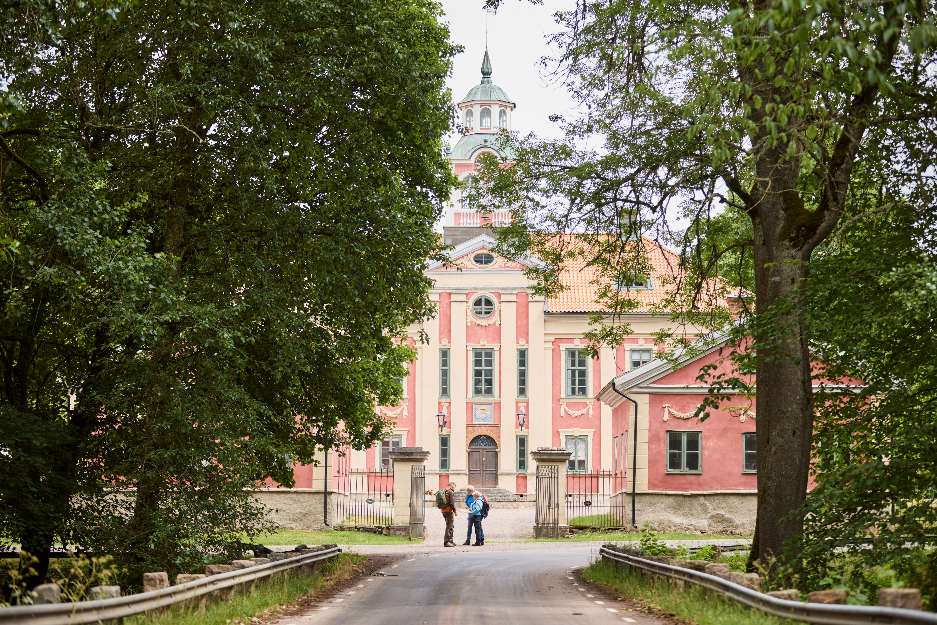 Hikers outside a castle.