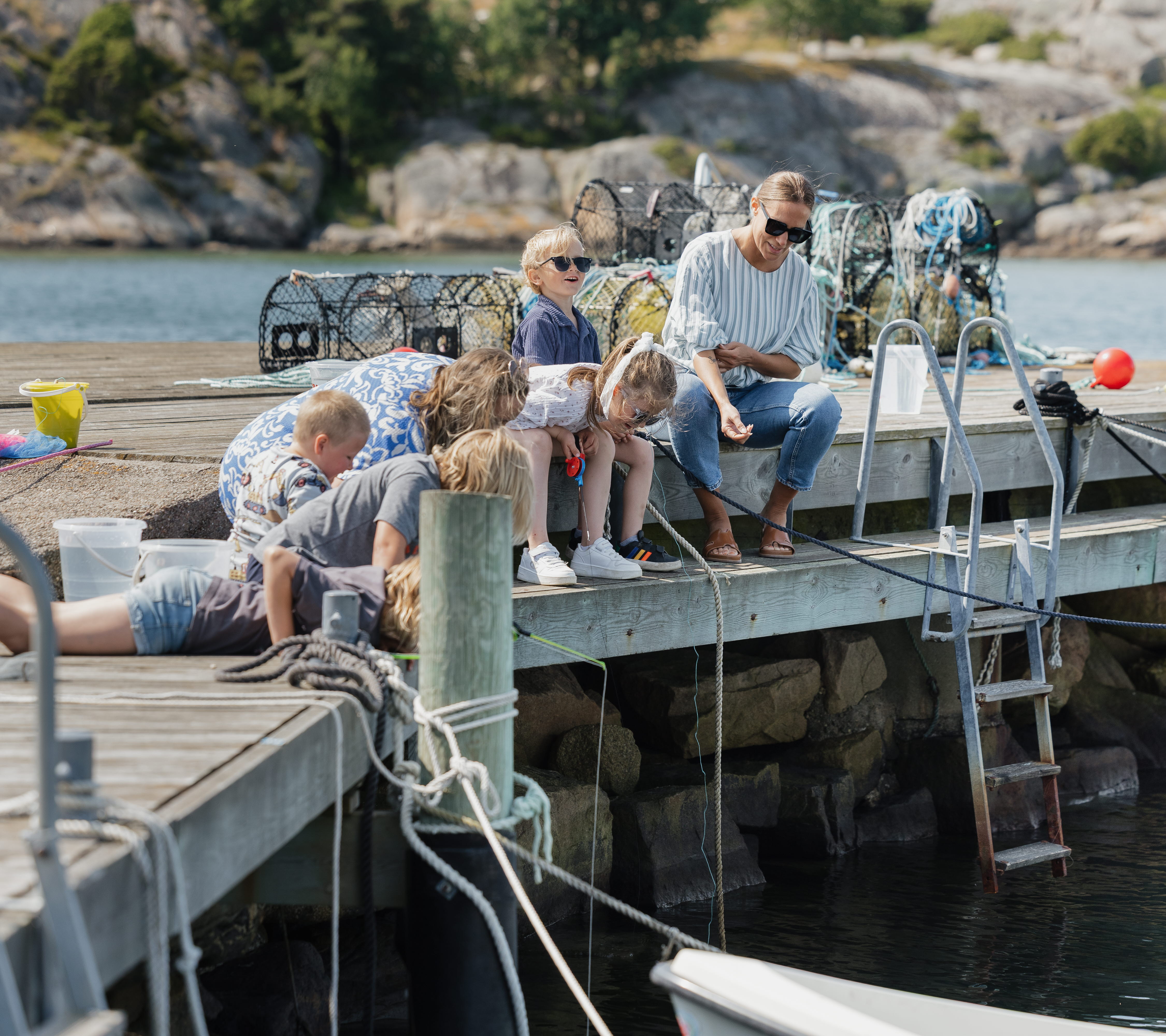 Children fishing for crabs.