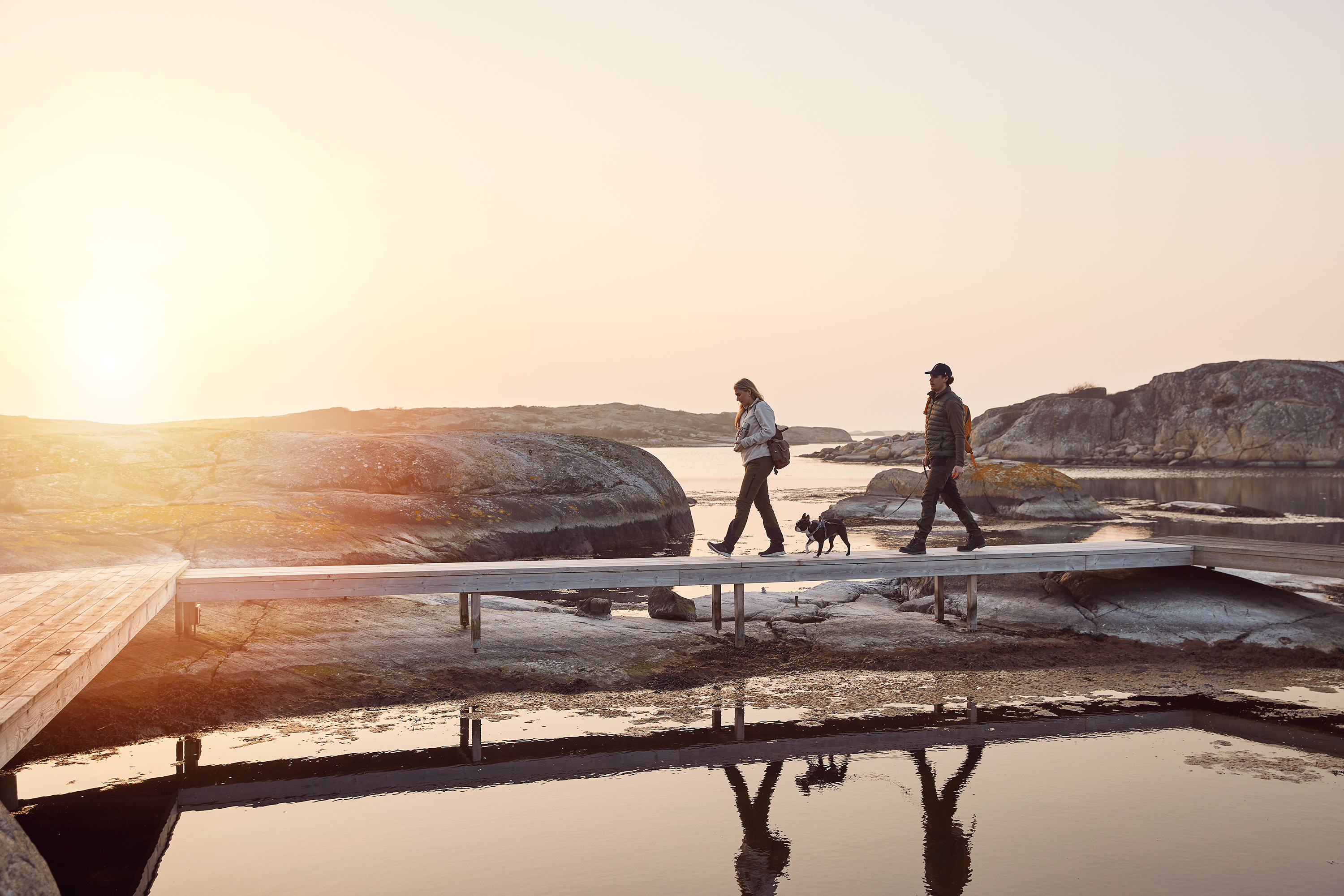 Two people and a dog in the archipelago.
