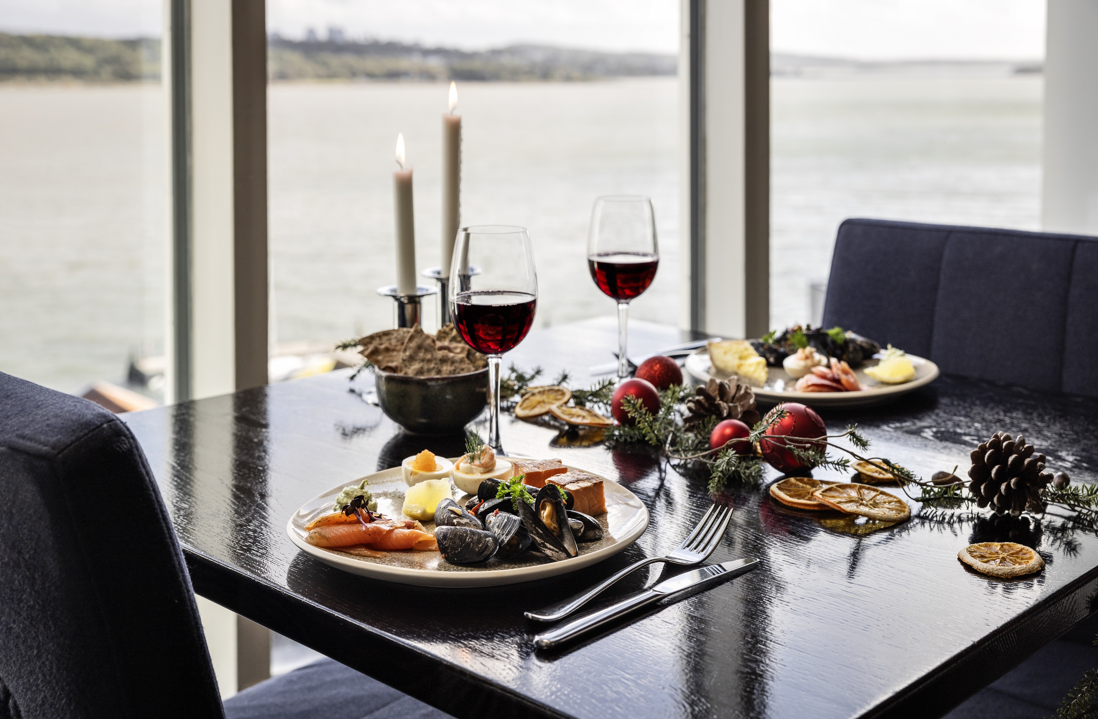Set table with Christmas food.