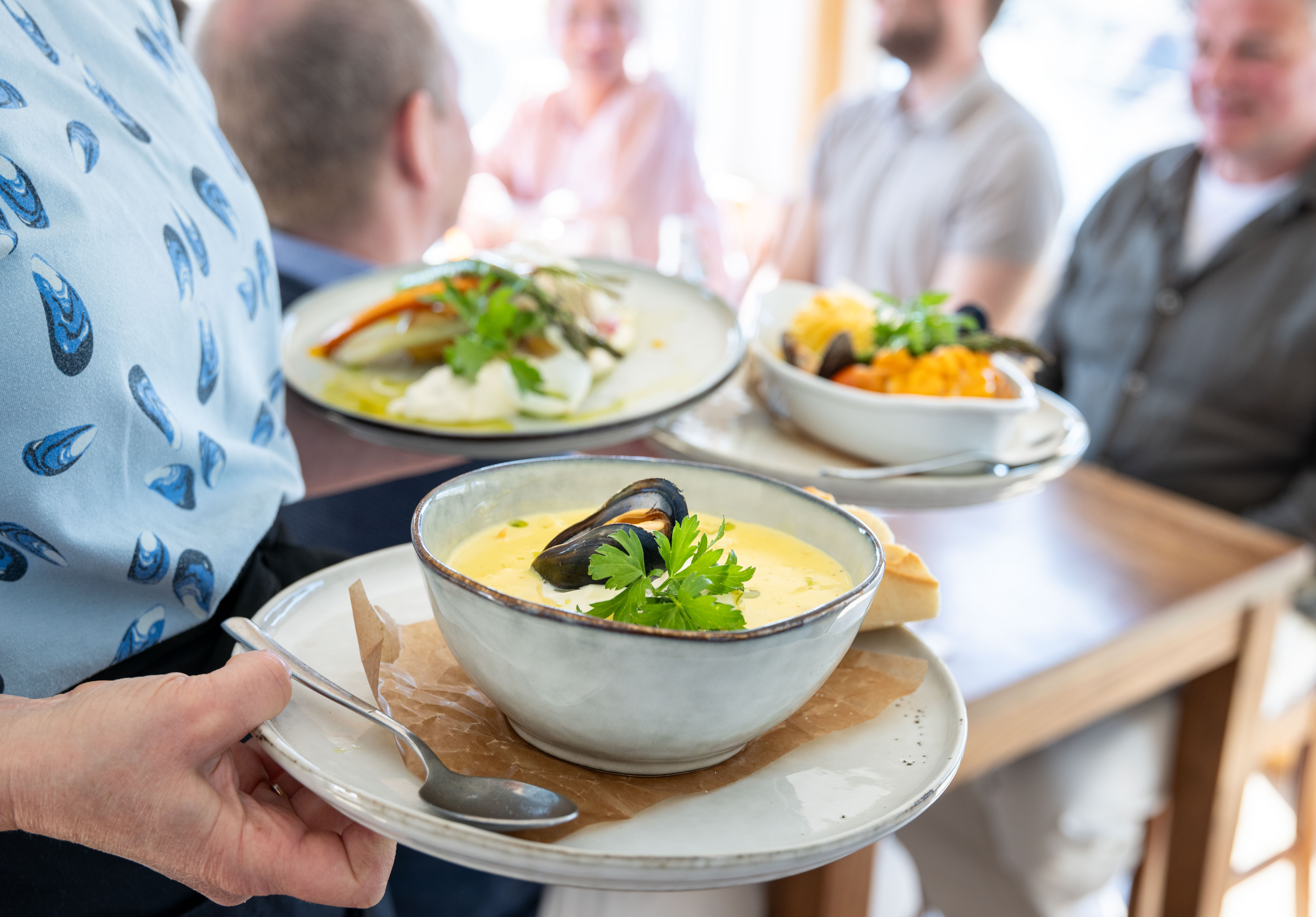 People sitting on a restaurant. 