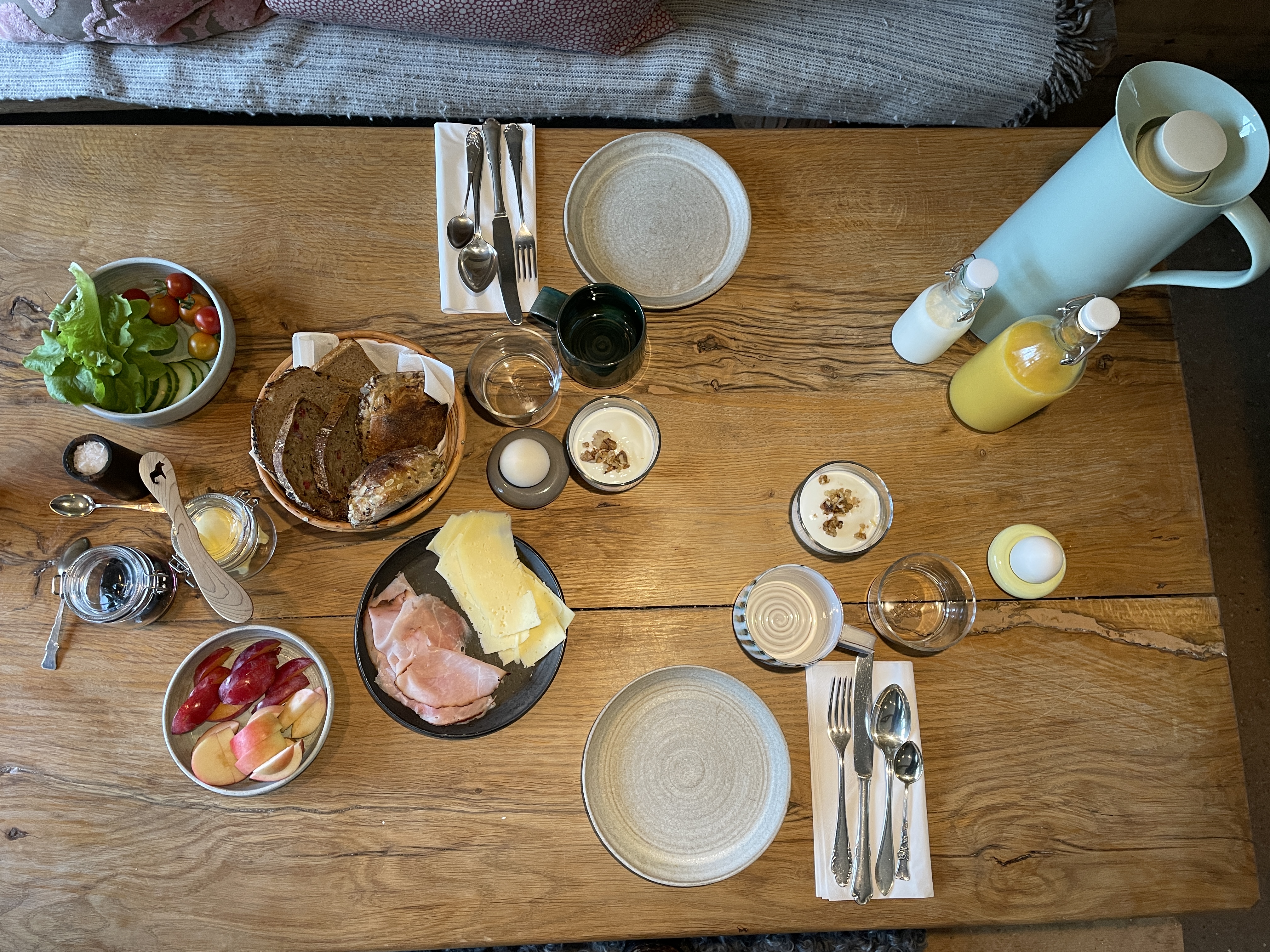 Breakfast laid out on a wooden table.