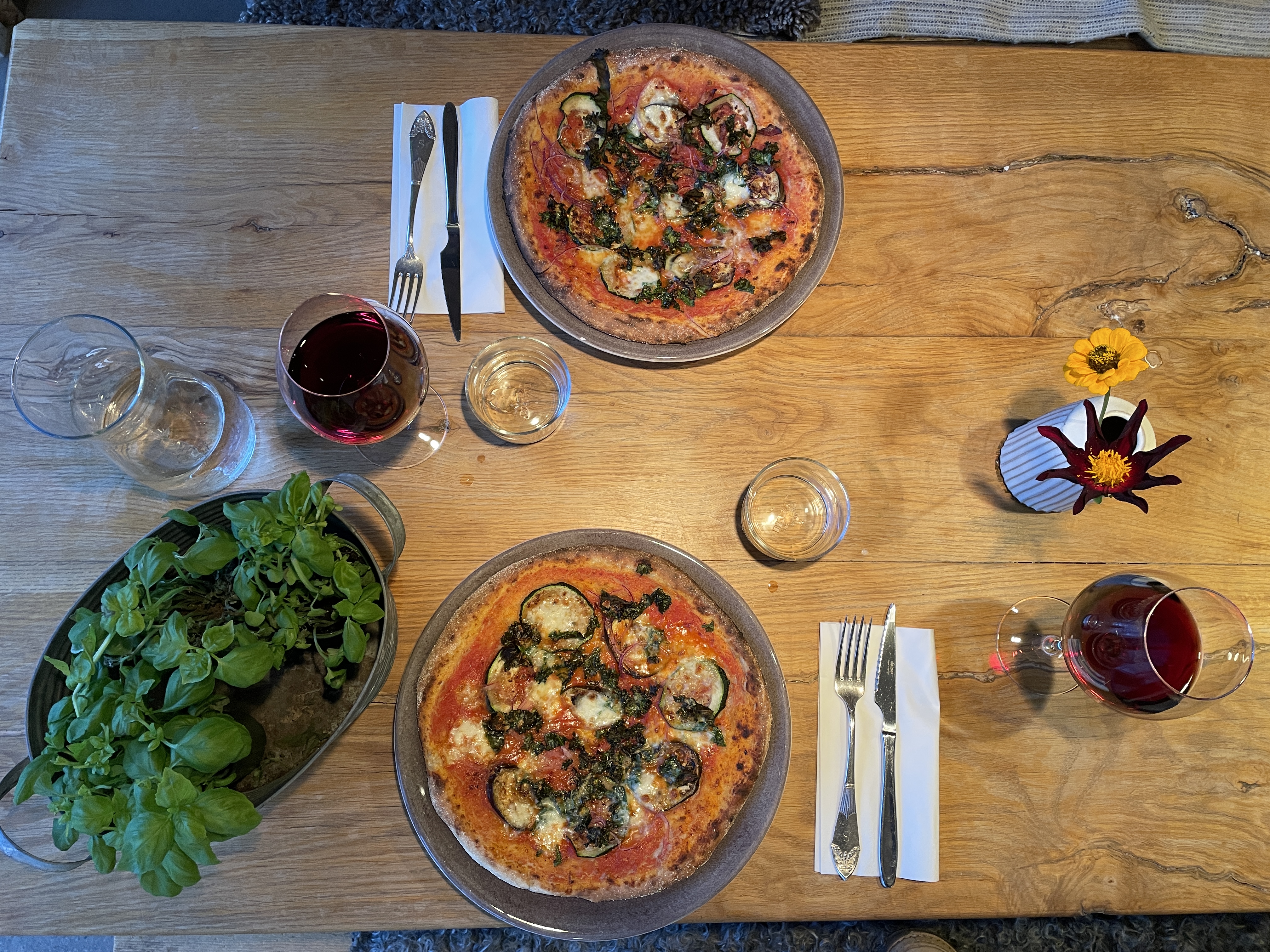 Pizza laid out on a wooden table.