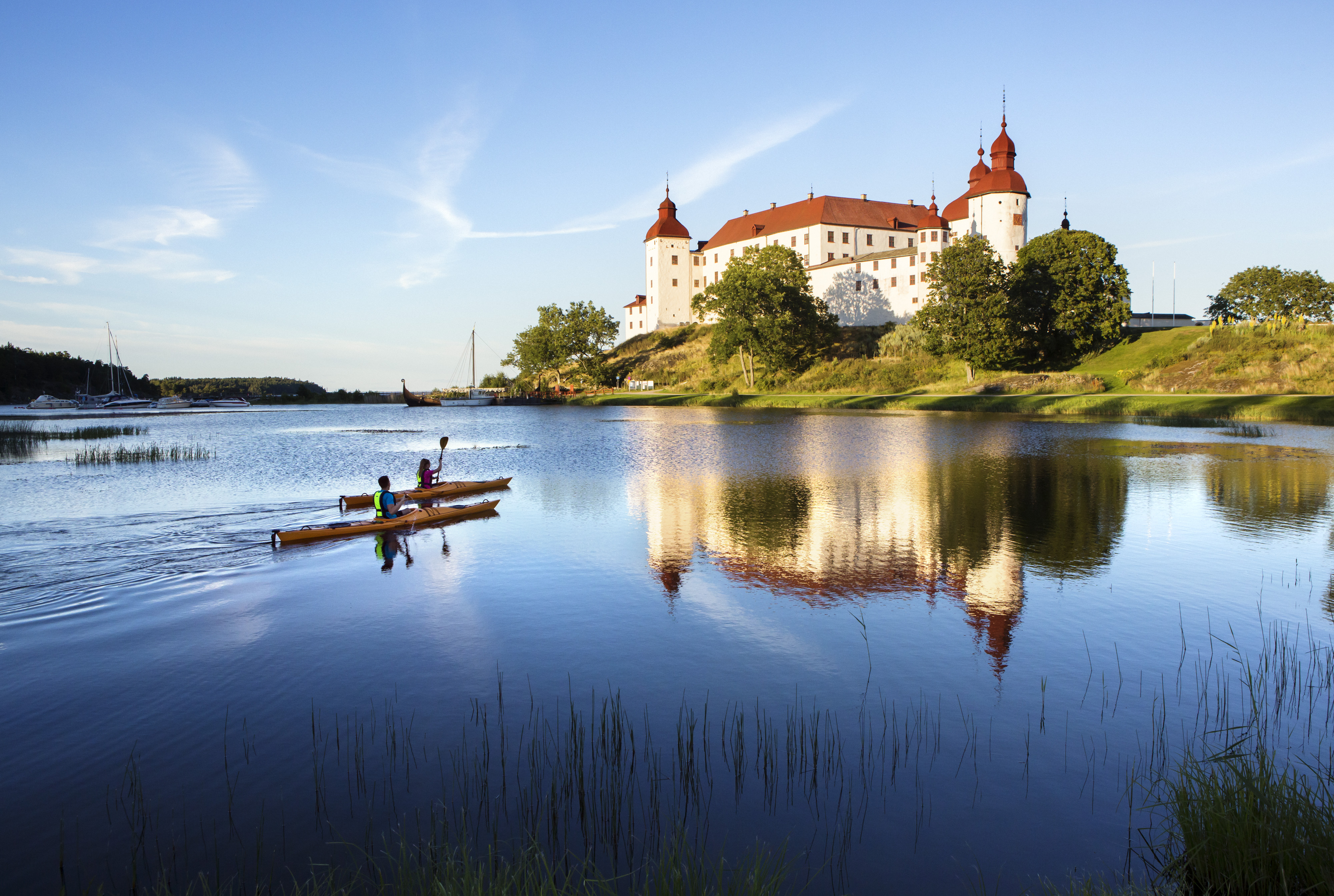 Couple kayaking outside a white castle