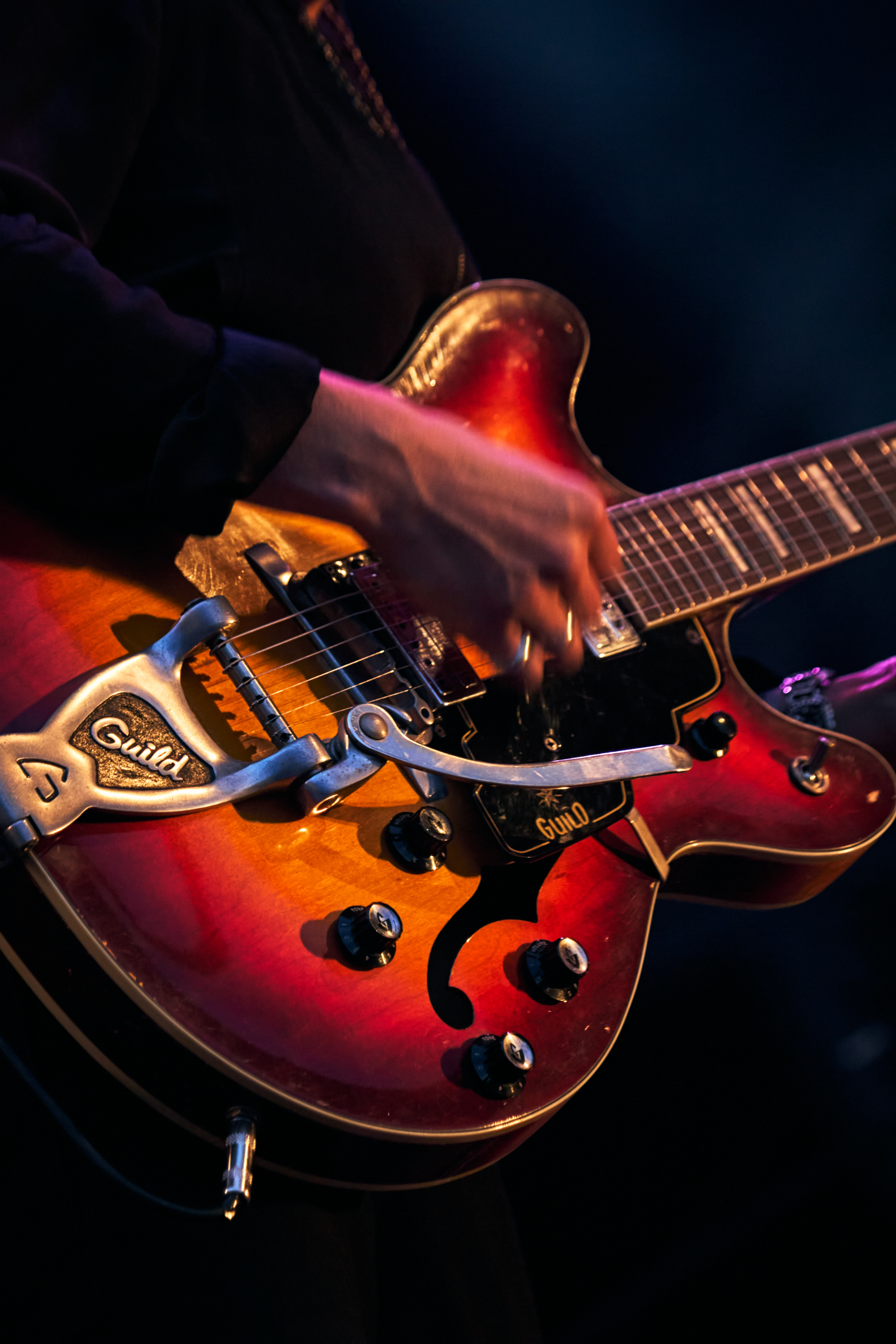 Musician playing instrument.