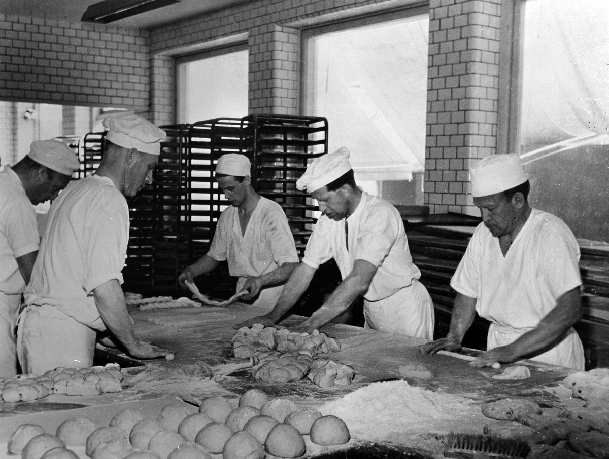 Making of coffee bread. Five bakers work with the dough.